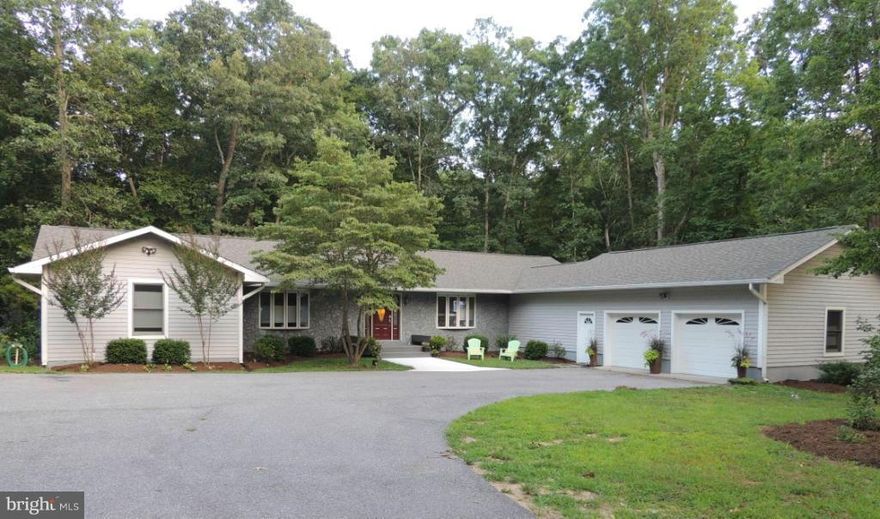 Fully renovated, gourmet kitchen, open flr plan, lots of storage, garage has slat wall system & extra elec. panel for use during power outage. 4ft wide hallway, custom ceiling fan, rec lights, hardwood thruout. Large windows to let the outside in. Great for entertaining w/half moon engineered wood deck off great rm. Wide front entryway with engineered wood porch w/ built in benches. Home Warranty!