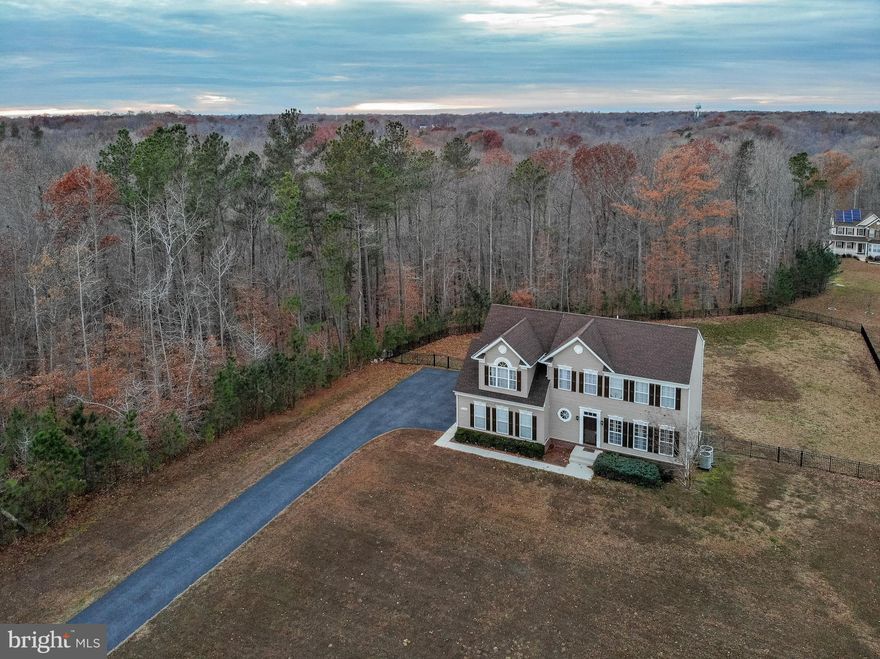 Looking for that perfect fit?  Stop by this expansive space in a convenient location! This 4 bedroom, 3.5 bath home in Ben Oaks on a rare 2-acre level lot with a fully fenced backyard, is ready for both two and four-legged family members to enjoy!  It offers both large open spaces for holiday gatherings, and the bonus of separate living and dining rooms for your more intimate gatherings.  Your new home on Claires Drive is warm and inviting, with professional custom painting throughout.  The kitchen offers the chef in the family a gas cook top, stainless steel appliances, and a large island open to the family room with a gas fireplace  - a great place  to curl up on cold evenings.  Also open to the kitchen, the morning room has more abundant space that will accommodate a breakfast table for 4, as well as a large chaise lounge and coffee bar for your slow-start mornings, and this space can also be reconfigured to seat a large social gathering.  The living and dining room are separated by glass french doors for times when a little quiet or privacy is desired.  Upstairs, you will find four generous bedrooms and two full baths.  The grand owner's suite offers plenty of space for a king sized bed and all of its complementary furnishings.  Two walk-in closets flank the entrance to a private and serene sitting room with a beautiful large window full of light, even on rainy days.  The owner's bath features double sinks, a private powder room, soaking tub, and a grand shower with two shower heads, curved seating, and glass block wall for light with privacy.  The huge basement has a full bath completed, and the other rooms await your vision.  There is a wet bar rough-in and extra beams were added to eliminate that misplaced pole that can be so hard to work around. Don't wait, make this your new home today!