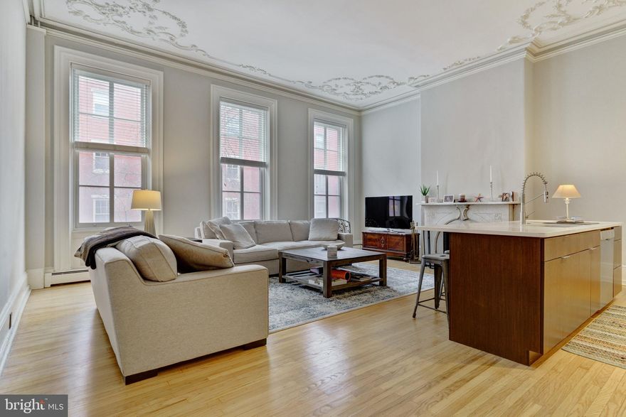 Charm, location and convenience. A luxurious, large, light filled 2nd floor one bedroom home close to the Rittenhouse Square park and minutes to many wonderful neighborhood restaurants and cafes. The grand great room features high ceilings with distinctive rich plaster work detailing. The kitchen is modern and open with a breakfast bar big enough for 4 people to sit comfortably. Three large, tall windows span the living room/dining area offering street views to Spruce. The main spacious bedroom has a walk in closet and private marble bath, with an artistic glass bath entrance door which is a conversation piece in itself.  Private storage closet in basement. A truly unique home in a wonderful condo building. Tenant to have unit professionally cleaned when departing at the end of lease. New AC unit and compressor. Monday-Friday parking available for $250 a month ( no weekends)