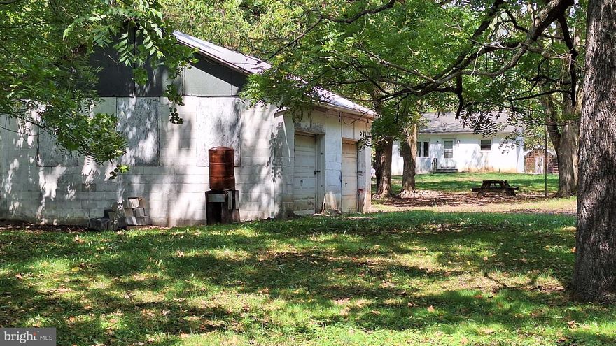 BACK ON MARKET = NO FAULT OF SELLERS  -UNRESTRICTED! UNRESTRICTED! UNRESTRICTED! REDUCED PRICE with 7.538AC NEAR ROCKS ON RT 28N.  2 bedroom home with family room. NEW Kitchen Flooring & Entrance Door! Hardwood Floors thru home. Public Water and Well Exists.  SPRING FED Stream on property and a pond, too. 2 car garage and couple of sheds exist. Close to South Branch of Potomac River access and Potomac Eagle Train Station.  Fencing needs to be updated to keep farm animals.  Seclusion but close to Rt 28N. Just three miles from TOWN OF ROMNEY and only minutes from Cumberland, MD.  and Winchester, VA.  Located beside CRYSTAL VALLEY RANCH. Should Qualify for VA, ETC. THIS PROPERTY WAS APPRAISED FOR 190K!!!!  MAKE AN OFFER!!