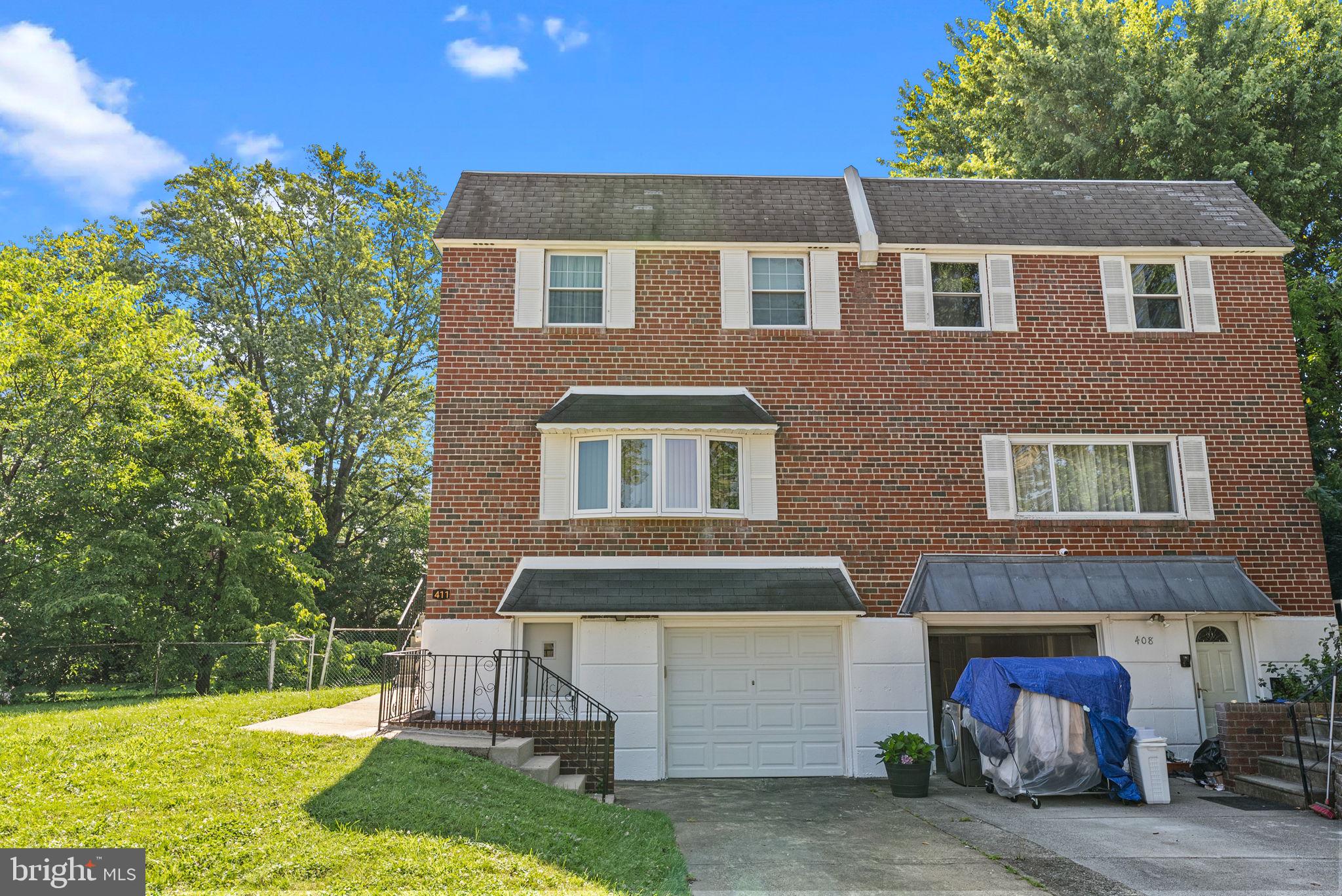 Welcome to 411 Audubon Plaza, a beautifully maintained brick twin located on a quiet cul-de-sac in the highly sought-after Somerton section of Northeast Philadelphia. Situated on a generously sized lot, this home features an expansive rear yard perfect for outdoor entertaining. Step inside to find charming, exposed hardwood floors throughout the main level. The main floor offers a spacious living room highlighted by recessed lighting and a large bow window that fills the space with natural light. You'll also find a formal dining room, a well-appointed eat-in kitchen with ample cabinetry and counter space, and a convenient powder room.
Upstairs, the large primary suite features dual closets, a private vanity area, and an en-suite bath with stall shower. Two additional bedrooms and a hall bath with a shower and soaking tub combo complete the upper level. The fully finished basement offers additional living space with sliding glass doors that lead to a huge rear yard, complete with a concrete patio and a built-in gas grill connected to a direct gas line—ideal for year-round entertaining. A dedicated laundry room, exterior access to the 1-car garage with electric opener, and a driveway for additional off-street parking add to the home’s appeal.
Enjoy the benefits of a vibrant neighborhood known for its tree-lined streets, access to top-rated schools and restaurants, and excellent proximity to public transportation, shopping centers, and major highways. This home combines comfort, space, and convenience—don’t miss your opportunity to make it yours!
