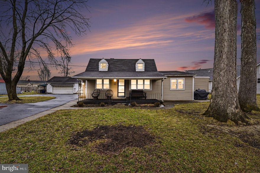 Welcome home! This updated Cape Cod is situated on nearly a half acre of fully fenced property, offering space, flexibility, and convenience in a desirable water oriented community with tons of local attractions. A large driveway, carport, and detached two-car garage (sold as is) provide ample parking. Enjoy the welcoming front porch, perfect for relaxing and taking in the expansive yard. Inside, the living room features custom built ins, ideal for all your entertainment needs. The adjacent dining room flows seamlessly from the living space, making it perfect for everyday meals or hosting gatherings. The spacious kitchen is a chef’s dream, complete with stainless steel appliances, granite countertops, and a stylish backsplash. Just off the kitchen, the sunroom offers versatile additional living space. All three bedrooms are conveniently located on the main level, along with an updated full bathroom centrally positioned for easy access. Upstairs provides a blank canvas, currently used for storage but full of potential for future expansion. The lower level adds even more living space and can be used as a home office, gym, or media room. It also includes a half bath, laundry area, and utility room. This home offers the perfect blend of comfort, space, and lifestyle.