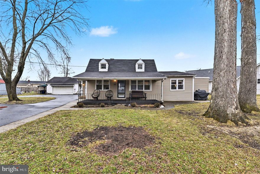 Welcome home! This updated Cape Cod is situated on nearly a half acre of fully fenced property, offering space, flexibility, and convenience in a desirable water oriented community with tons of local attractions. A large driveway, carport, and detached two-car garage (sold as is) provide ample parking. Enjoy the welcoming front porch, perfect for relaxing and taking in the expansive yard. Inside, the living room features custom built ins, ideal for all your entertainment needs. The adjacent dining room flows seamlessly from the living space, making it perfect for everyday meals or hosting gatherings. The spacious kitchen is a chef’s dream, complete with stainless steel appliances, granite countertops, and a stylish backsplash. Just off the kitchen, the sunroom offers versatile additional living space. All three bedrooms are conveniently located on the main level, along with an updated full bathroom centrally positioned for easy access. Upstairs provides a blank canvas, currently used for storage but full of potential for future expansion. The lower level adds even more living space and can be used as a home office, gym, or media room. It also includes a half bath, laundry area, and utility room. This home offers the perfect blend of comfort, space, and lifestyle.