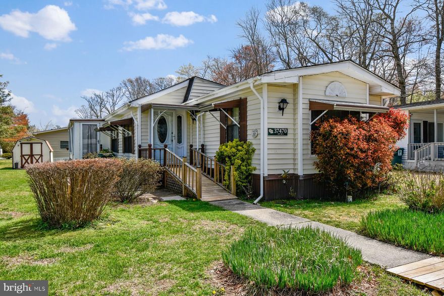 Welcome to this cozy home, where coastal living is simplified in a spacious single-story layout located in the sought-after community of Shady Park. Offering over 1,100 sq. ft. of effortless one-level living, this residence features 2 large bedrooms and 2 full bathrooms in a desirable split-floor plan designed for maximum privacy. The interior boasts a light-filled open-concept layout with an entry-level primary suite and main-floor laundry, ensuring a comfortable, stair-free lifestyle.   Outdoor enthusiasts will appreciate the private driveway with ample parking and the community’s premier water amenities, including an exclusive boat ramp and kayak launch providing direct access to the Creek and the Little Assawoman Bay. Located just 4 miles from the Beaches of Fenwick Island and Ocean City, this Shady Park gem offers the perfect balance of peaceful neighborhood charm and coastal adventure.