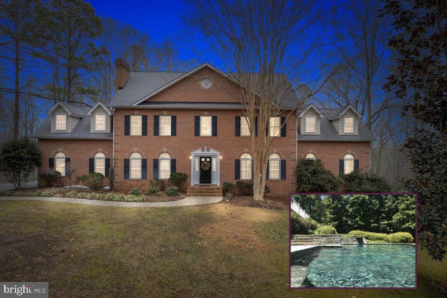 Luxury home on 5 private wooded acres in sought-after Calvert County, Maryland with Chesapeake Bay boating access. Bordered by 121 acres of protected community open space, this property offers rare privacy, natural views, and resort-style amenities.

The oversized kitchen features solid cherry cabinetry and expansive prep space ideal for entertaining. Main level includes a dramatic second family room with soaring ceilings and abundant natural light.

Upper-level primary suite retreat with gas fireplace, sitting area, dual walk-in closets, and spacious bath. Convenient upper-level laundry with direct primary suite access.

Finished walk-out lower level includes theater room, custom bar crafted from on-site wood, secondary kitchenette, and fitness or hobby room.

Outdoor living features a heated 9-ft deep gunite pool with diving rock and fountain. Community marina and boat ramp on Saint Leonard Creek off the Patuxent River for boating, fishing, and waterfront recreation.

Private acreage. Luxury features. Southern Maryland lifestyle.