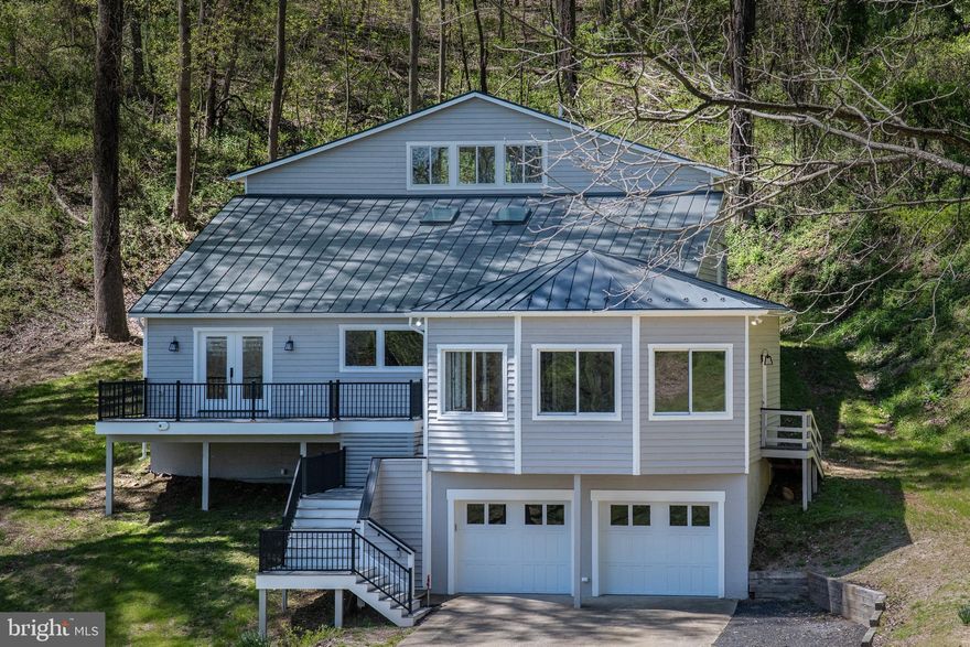 Need to move away from covid-19? Here is how you can do it.  Step one check out these pictures Step two come see this view in person. Step Three fall in love with this fully remodeled bungalow sits atop the mountain overlooking beautiful rural Fauquier County. The setting for this home is an example of ultimate tranquility while being only minutes from downtown Marshall. The kitchen is stunning with attention paid to every detail, including the wine fridge that will be easily filled due to the home s proximity to several top notch wineries.  With panoramic windows in the extra large family room, it's easy to take in the breathtaking views while hosting the entire family for the holidays. Up one level from the kitchen area is the  Luxurious Master Suite, with a plethora of closets for storage and clothing.  The gorgeous en-suite master bath sports a double walk in shower and an abundance of natural light. A dedicated laundry  room  and half bath finish out this level. The next level consist of two bedrooms and a full bath that has no expense spared. As for the top floor loft area, if you thought the views couldn't get any better than the living room you will be surprised! This area has limitless uses with a view.  Home being sold with additional buildable lot the five acre lot included is PIN # 6040-35-0734 . This home has it all and is a must see.