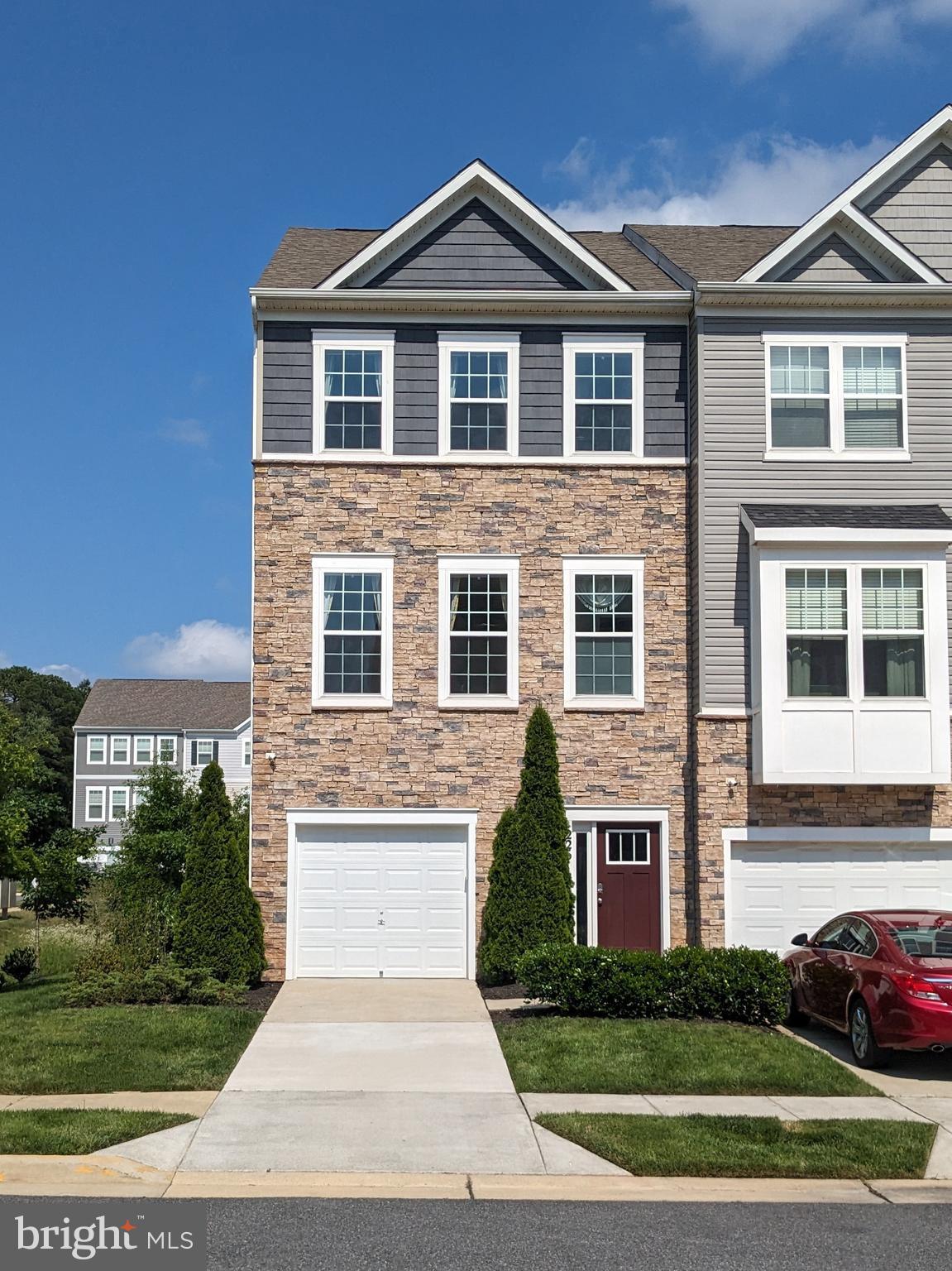 Welcome to 2261 Kelston Place, Odenton, MD 21113End-Unit Townhome | 3 Beds | 3.5 Baths | 2,200+ Sq Ft | 1-Car Garage.
Stunning, like-new end-unit townhome in desirable Odenton Town Center! Built in 2018, this 3-level home features over 2,200 sq ft of living space and a stone-front exterior on a beautifully landscaped lot. The entry level offers a flexible rec room/home office/guest suite with a full bath and walk-out to the backyard. Access your 1-car garage directly from this level, offering convenience, secure parking, and extra storage. The main level boasts an open floor plan with 9' ceilings, wide-plank LVP flooring, and a gourmet kitchen with quartz counter tops, a large center island, stainless steel appliances, and pantry. Spacious dining and living areas lead to a private deck, perfect for outdoor entertaining. Upstairs, the primary suite includes a walk-in closet and a luxury en-suite bath. Two additional bedrooms, a full hall bath, and an upstairs laundry room complete the top floor.
Upgrades include:
✔️ Smart security system,
✔️ Energy-efficient HVAC and water heater,
✔️ Professionally landscaped yard,
✔️ Luxury finishes throughout,
Community features: tot lot, walking trails, and unbeatable access to Ft. Meade, NSA, Odenton MARC Station, BWI, Arundel Mills, shopping, dining, and commuter routes (175, 32, 97).