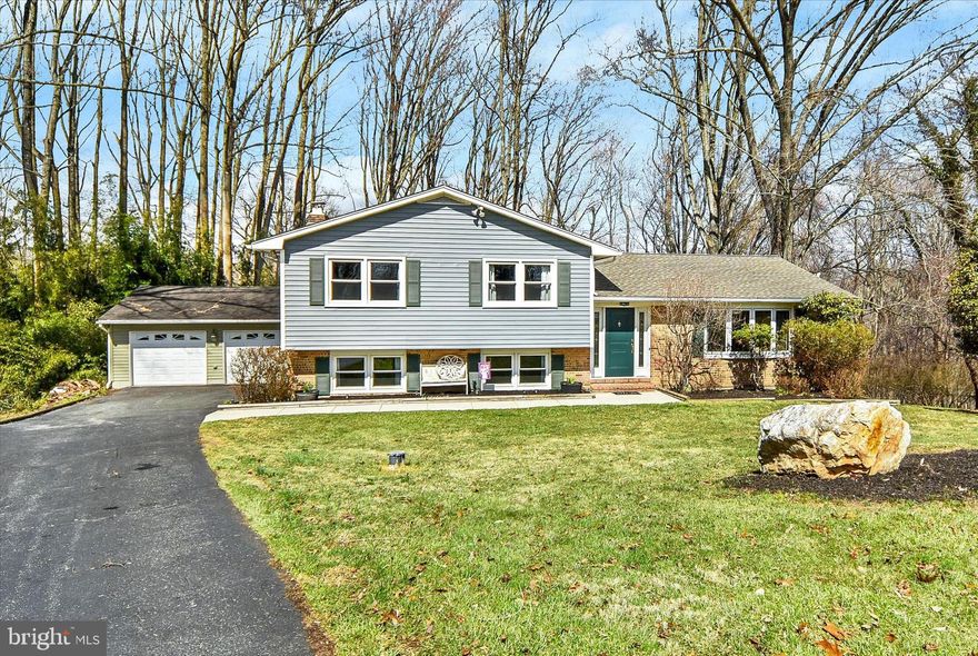 Welcome to 1504 Groveton Court in Fallston—a beautifully updated, move-in ready split foyer tucked at the end of a quiet cul-de-sac, offering privacy, space, and serene wooded views.

Step inside to a welcoming foyer with a convenient drop zone for coats and shoes, setting the tone for the home’s functional and inviting layout. The main level features a bright, airy living room filled with natural light, complemented by gleaming refinished hardwood floors (2021) and a soft, neutral color palette. The adjoining dining room showcases a stylish light fixture and seamless flow—perfect for both everyday living and entertaining.

The spacious kitchen offers abundant cabinetry, generous counter space, and a window overlooking the peaceful backyard—ideal for keeping an eye on outdoor activities while cooking. 

Upstairs, you’ll find four generously sized bedrooms, each with great natural light and ample closet space, along with a well-appointed full bath featuring dual sinks and a tub/shower combination.

The lower level is an entertainer’s dream, featuring a large, cozy recreation room with a charming brick fireplace, custom wet bar, and sliding glass doors leading to the expansive multi-tier deck—perfect for indoor/outdoor entertaining. This level also offers incredible flexibility with an additional bedroom and a spacious second primary suite complete with a massive walk-in closet (featuring a custom built-in shelving system and lighting, June 2025) and a private en-suite bath with dual sinks.

Outdoor living truly shines here, with multiple deck levels ideal for relaxing, hosting, or enjoying the tranquil, tree-lined backyard. The detached two-car garage and long asphalt driveway provide ample parking and storage.

Additional highlights include dual living spaces for added flexibility, five total bedrooms, and numerous thoughtful upgrades: a high-efficiency Bosch HVAC variable system (2022), premium vinyl siding (2023), whole house water softener (2023), new well tank and components (2025), updated lighting throughout (2024), and a garage door opener (2024).

Offering space, comfort, and a peaceful setting—all in a sought-after Fallston location—this home is the perfect blend of functionality and charm. This one won't last long! Schedule your showing today!