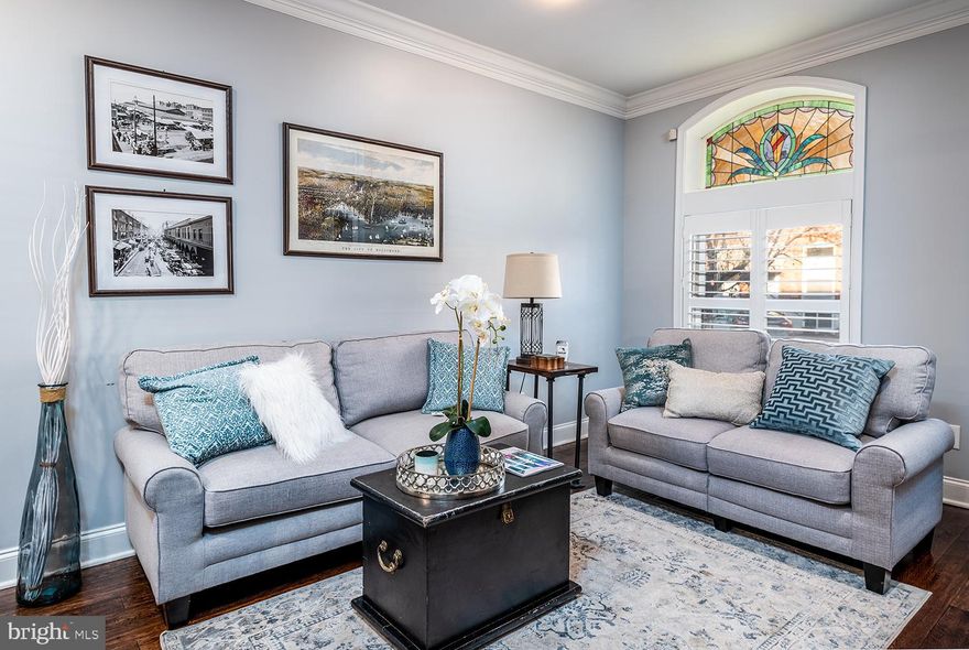 Immaculate beautifully renovated home with PARKING in Canton available now! This home will charm you with its original character and modern updates throughout. Open and inviting main level features exposed brick, crown molding, beautiful original stain-glass window, wide plank espresso wood floors, leading you into a fully updated kitchen with an eat-in island, stainless steel appliances and quartz counter tops. Second floor offers 2 bedrooms and 2bathrooms: a light-filled master with a gorgeous designer marble tile bathroom and a guest bedroom, that takes you out to a two-tier rooftop deck with picturesque views of Baltimore downtown and Patterson Park.  Lower level is perfect for a family room, home office or even guest quarters with an additional full bathroom and a bonus room at the rear. Parking pad in the back of the property will make your Canton living completely stress free, with your own designated parking space.