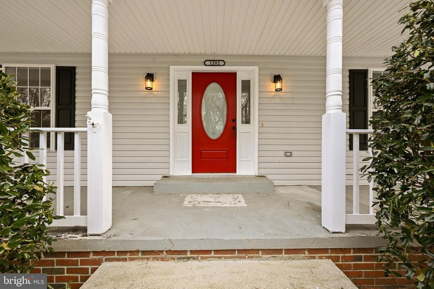 It's a charming Cape Cod-style home featuring four spacious bedrooms and three full bathrooms. The residence boasts a generous kitchen and an oversized family room, providing ample space for entertaining. Recent updates include new flooring, stainless steel appliances, and fresh paint. Situated on a beautiful wooded lot, the exterior offers a deck, patio, fenced yard, and a shed. Located on a quiet street, the home is a short walk to the beach within a beach-privileged community. The property is move-in ready.