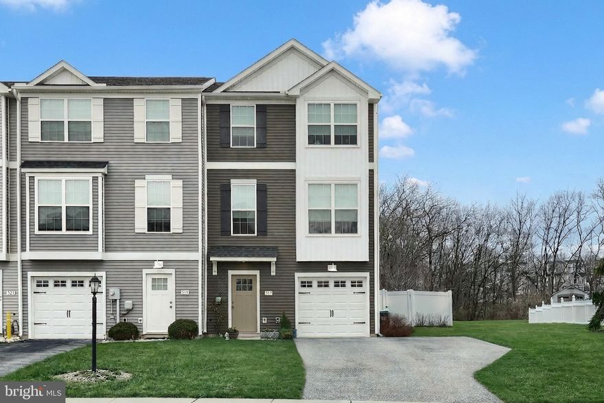 Enjoy the easy lifestyle of townhome living in a wonderful community conveniently located near dining, shopping, and entertainment.
This beautiful, move-in-ready townhome welcomes you with a bright foyer. Just off the foyer is a convenient half bath, leading into a spacious family room that opens directly to the backyard. The yard is completely fenced with solid-panel PVC privacy fencing and features a large patio with an awning—perfect for relaxing or entertaining. Beyond the fence is an additional shed, and the property backs to peaceful woods where you can often enjoy views of deer and nature.
The main living area is filled with natural light thanks to large windows, transom windows, and a sliding glass door that opens to the deck. The bright white kitchen features cityscape-style cabinetry, beautiful granite countertops, a center island with a breakfast bar, and a gourmet range hood. This open floor plan is ideal for entertaining and everyday living.
Upstairs, the primary bedroom features a cathedral ceiling, a spacious walk-in closet, and a private en-suite bath. The staircase and all bedrooms feature brand-new carpet, and the conveniently located laundry room is on the same level as the bedrooms. All appliances come with the home.
Additional upgrades include exterior water faucets for added convenience—including one on the deck—plus a gas connection already in place for a future fireplace. The one-car garage is oversized, and the home offers two additional driveway parking spaces.
The property also features lovely perennial gardens and a larger lot that provides extra privacy compared to many townhomes.