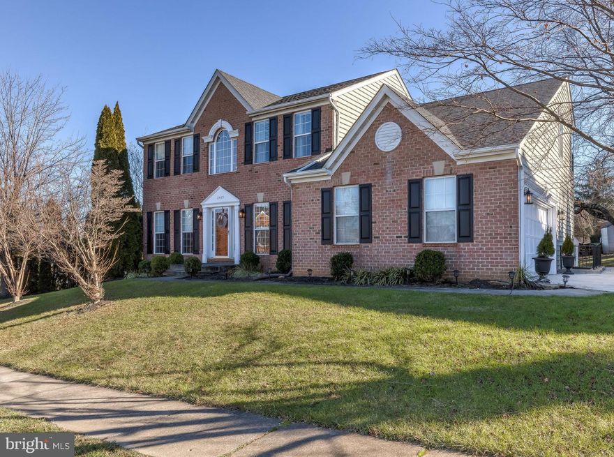 Updated throughout and well cared for home in highly desirable Satyr Hill Estates. Welcoming and open two floor foyer. Dining room with chair railing, crown molding, and hardwood floors. Formal living room with hardwood floors leads to sunny office. Large family room boasts vaulted ceilings and custom floor to ceiling stone wood-burning fireplace with reclaimed wood mantel (TV to convey). Renovated eat-in kitchen with ceramic tile floor, Bosch dishwasher/microwave/wall oven, GE gas cook top with built-in exhaust fan, newer  LG refrigerator with InstaView door (smart Wi-fi enabled), dry bar with wine/beverage refrigerator and two closets plus a sizable pantry. Large first floor half bathroom with updated vanity and faucet. The second floor includes hallway linen closet, updated hall bathroom, and spacious laundry room. Master bedroom with vaulted ceilings, custom his & hers walk-in closets (installed by Chesapeake Closets), and master bath with over sized ceramic tile shower, Moen shower jets/rain head, tub with retractable faucet, and double vanity with great storage. Updated light fixtures and 2" white blinds throughout. Basement finished in 2014 boasts 5th bedroom with cork flooring and double closet, large rec room, wet bar, custom built in entertainment center, full bathroom with glass shower, and storage GALORE! Rear yard includes trex deck and shed. Attached 2 car garage and additional driveway parking. Welcome Home!