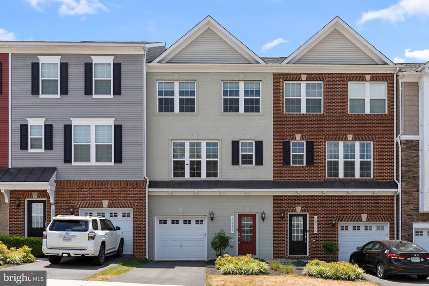 Amazing 3 level Townhome Near Downtown Haymarket! Bright Open Floor Plan with 4BR, 3.5 Bath, 1 Car Garage, and Over 2100 Sq Ft.  Loaded with Upgrades Including the Gourmet Kitchen Package, Wide Plank LVP Flooring, Upgraded Mill Work, All Bathrooms have 12 x 12 Ceramic Tile, 9 Ft Ceilings Throughout, Large Rear Deck, Paver Patio, EV Charger. and ADT Security System with Exterior Cameras and Doorbell Camera.

The Ground Floor Level Features a Spacious Foyer with Wide Plank LVP Flooring, Crown Molding, Hardwood Stairs, and Large Storage Closet.  Down the Hall you will Find the 3rd Full Bath, and 4th Bedroom/ Rec Room.  This Wonderful Flex Space is Currently used as a Home Gym and has a Closet and Sliding Door out to the Paver Patio. 

The 2nd Level is an Entertainers Dream and Offers a Wide-Open Floor Plan with LVP Flooring, Crown Molding, Recessed Lighting, Incredible Gourmet Kitchen, Living Room, Dining Room, Powder Room, and Large Rear Deck.  The Gourmet Kitchen Offers a Huge Eat-In Center Island, Quartz Counters, Pendant Lighting, Stainless Appliances with Double Ovens, Gas Cooktop, Custom Tile Backsplash, Soft-Close Cabinetry, and Farm Style Sink.  

The Top Floor Includes 2 Secondary Bedrooms, one is Accented with Custom Wainscoting and Draperies.  There is also a Laundry Room with LG Washer and Dryer, and Spacious Owners Suite with Walk-in Closet, Draperies, Crown Molding, and Private Luxury Bath with 12 x 12 Ceramic Tile, Double Vanity, and Glass Enclosed Shower with Bench Seating.

Additional Features include Custom Window Treatments and Door Shades, Ceiling Fans, 1 Car Front Load Garage with Garage Door Opener, EV Charging Station, and Storage Area.  There is also an ADT Security System with Front and Rear Cameras, Doorbell Camera, Glass Break and Door Alarms, and Control Panel.  The Mounted TV's in the Rec Room and Living Room will also Convey.

The Haymarket Crossing Community has a Great Location - Close to Downtown Haymarket, Shopping, the Hospital, Schools, and Major Commuter Routes Including RT 66, RT15, RT29.  Come and see this Beautiful Townhome Today-