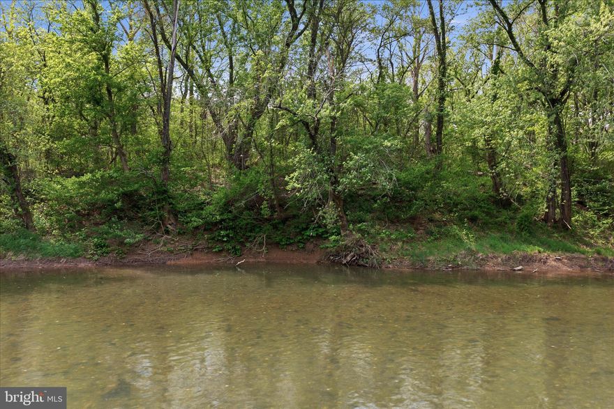 Enjoy camping here!   Bring your camper to leave all summer so you can come enjoy yourself on the weekends!  Let your friends bring their campers.   Enjoy the water and nights around the campfire! This property is a unique find. 4.86 acres with 318.94 feet of water frontage along the Potomac River.  It offers an ideal setting for extended weekend getaways, featuring opportunities for fishing, swimming, kayaking or just relaxing.   Newly surveyed and perc test approved.