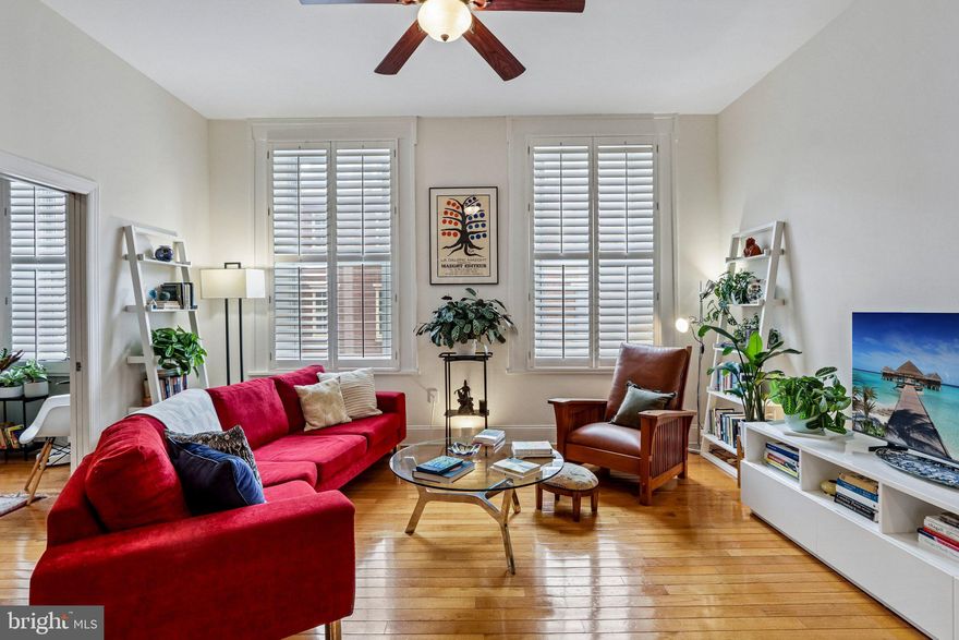 Welcome to vibrant city living in the heart of Washington Square West—one of Center City’s most sought-after locations.  Nestled within a secure building serviced by the Lenox Building’s 24/7 front desk (connected through the backyard), this stunning second-floor condo blends modern updates with timeless style. Enter inside to a bright, open-concept layout highlighted by soaring 10.5-foot ceilings and an airy, expansive feel. The living room is bathed in natural light through oversized windows with elegant shutters, offering both privacy and soft, diffused sunlight. The seamless flow from living to dining creates an ideal space for entertaining, anchored by a beautiful kitchen featuring granite countertops, stainless steel appliances, and a breakfast bar with seating. The generously sized primary suite is a true retreat, complete with oversized windows, a walk-in closet outfitted with an Elfa system, and the convenience of an in-unit Bosch stacked washer and ventless dryer. The ensuite bath features a walk-in shower. A versatile second bedroom sits just off the living area behind pocket doors—perfect as a guest room, expanded living space, or a private home oﬃce—and includes its own ensuite bath. This home has been thoughtfully upgraded throughout, including a newer Bosch dishwasher, designer lighting in the dining room and over the breakfast bar, fresh paint throughout, Nest thermostat and smoke detectors, a Schlage smart lock, and updated bathroom fans and shower heads. Residents enjoy a host of valuable amenities covered by the condo fee, including commercial trash service, security cameras on exterior doors and entrance, 24/7 front desk service, package handling, and upcoming improvements such as a planned updated intercom system and fire escape installation. A 24/7 parking lot offering hourly, daily and monthly parking is located on the same block for both owner and guest convenience. Located just one block from the Kimmel Center and the Broad Street Line, and only a short stroll to Rittenhouse Square, Old City, and some of Philadelphia’s best dining and shopping, this home places you at the center of it all. Plus multiple grocery stores and everyday conveniences are just blocks away. Experience elevated urban living in a vibrant, connected neighborhood—this is Center City at its finest. Mortgage savings may be available for buyers of this listing.
