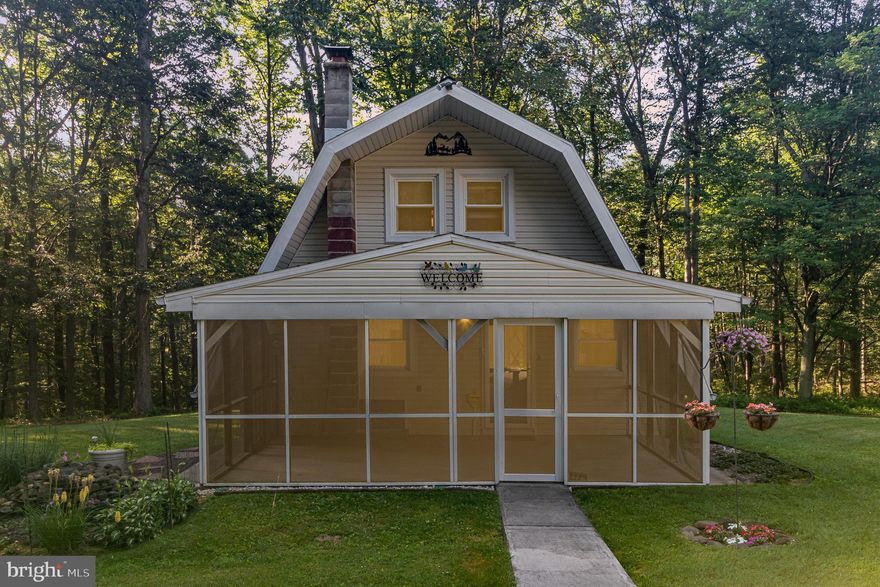 Tucked away on 7 wooded acres in the Northern York School District, this one-of-a-kind property offers a rare blend of serenity and convenience. A private drive takes you to the charming modified A-frame home features 3 bedrooms, 1.5 baths, and a spacious, open-concept living area centered around a double fireplace with a striking stone hearth. Enjoy the outdoors from an oversized screened-in porch, private rear patio, and second-story balcony—each offering peaceful views of the surrounding private woods and stream.  A detached 3-car garage provides added storage or workspace flexibility. Whether you're looking for a full-time residence, a private weekend retreat, or a short-term rental opportunity, this scenic setting is full of potential. Just minutes from town and key commuting routes, this property offers a sense of escape without sacrificing accessibility. *Please note: this property is a private residence and drive-by's are not permitted. The property should be accessed and home shown by appointment only.*