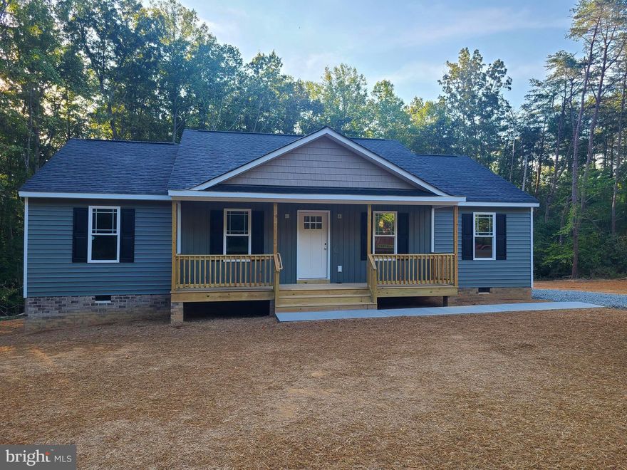 Welcome to this beautiful brand new 1400 sq ft 3 bedroom 2 bath custom built rancher with a country front porch and large deck sitting on 5.0 wooded acres. Most of the property is mature hardwoods.  This home has a country living room, spacious kitchen with white cabinets, recessed lighting,  granite countertops, stainless steel appliances to include dishwasher, over the range microwave, free standing oven, and refrigerator. Large primary bedroom with a walk in closet, primary bathroom with a double vanity and stand up/ walk in shower. All bedrooms and living room have ceiling fans and are cable ready. Enjoy the country life with no HOA. Lake Anna is just 5 minutes away. Don’t let this one get away. Pictures are from a previous built house. House will be 100% finished by end of September. Includes 12 month builder warranty. Make reasonable offer today.