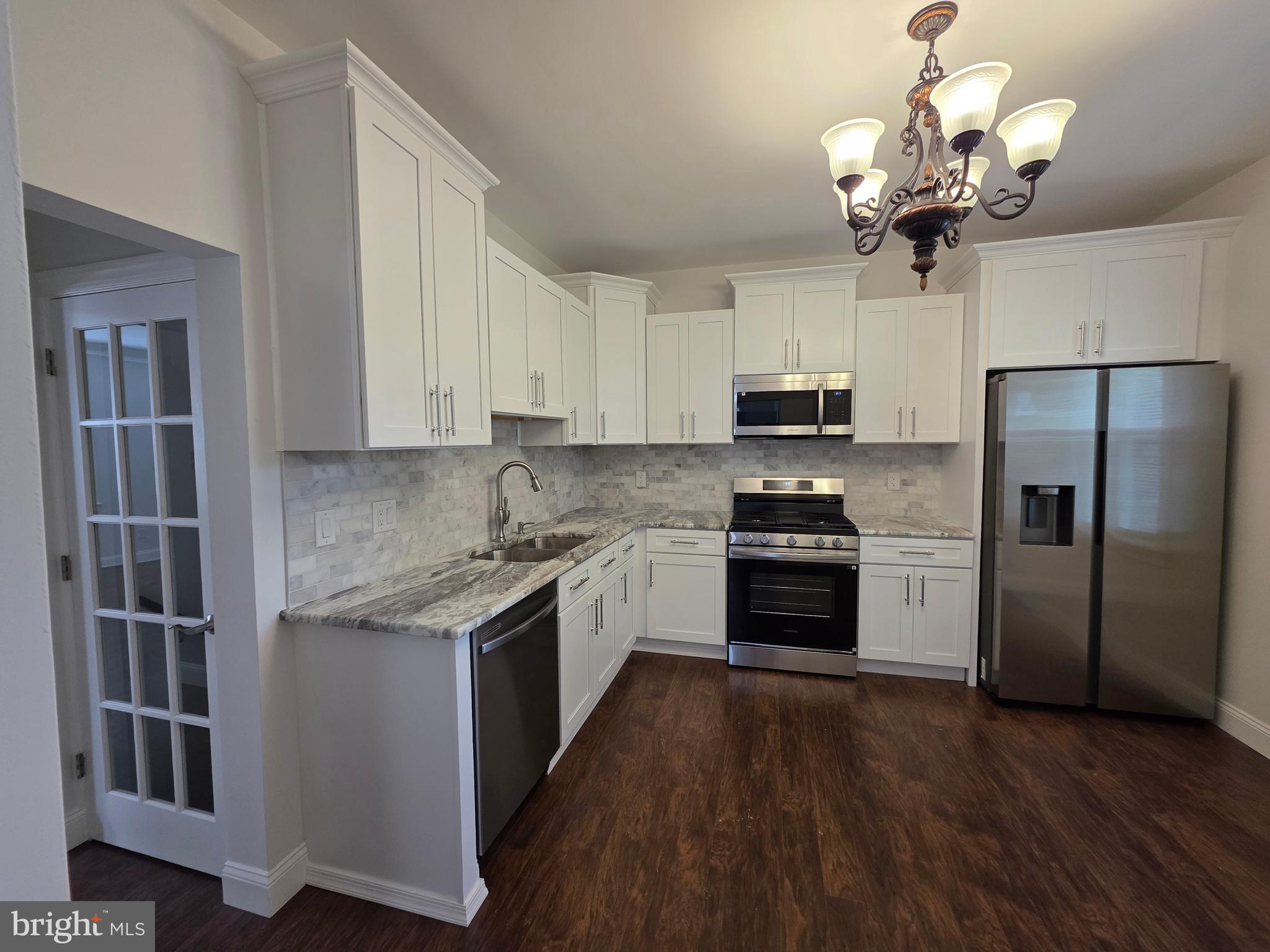 Welcome home to this gorgeous, newly renovated property, ideally situated on the quiet block of historic Germantown. This spacious residence with high ceilings redefines comfort and style, distinguished by a custom-crafted fireplace, an elegant chandelier casting a beautiful glow throughout the main floor, and exquisite custom trim work accented by hand-picked colors. Every detail has been thoughtfully designed to create an undeniably cozy and inviting atmosphere the moment you step inside. The stunning new kitchen, featuring exotic granite and stainless-steel appliances, is a true chef's delight. Enjoy peace of mind with a new roof, new high-efficiency central air system, updated plumbing and electrical service, new windows and much more. All bedrooms are nicely sized, and offering abundant closet space. Convenient main-floor spacious laundry, a fully finished basement with a full bathroom and lots of closet space.
Private fenced backyard perfect for relaxation or entertaining.