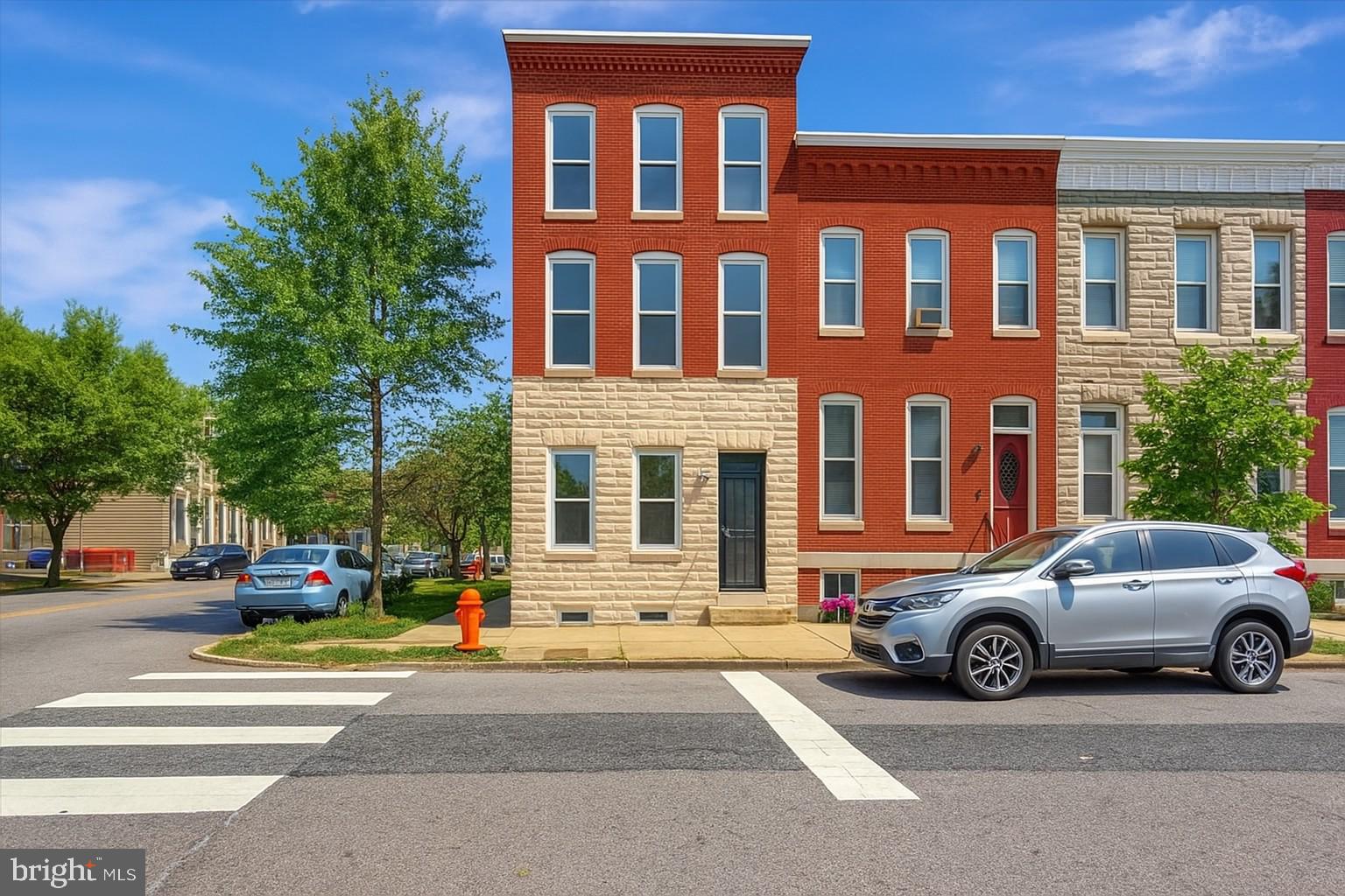 Meet the luxurious 1541 N Bond Street, an end of group, three-story plus a basement, Italianate-style home waiting for the perfect buyer. This home features a new roof with 10-year warranty, coffered ceilings, crown and chair molding, and exposed brick throughout. It is spacious, and the open floor plan gives you freedom to easily flow from one area to the next.
Walking into the home, the large open concept LR, DR, and kitchen with stainless steel, energy efficient appliances, granite countertops, high end flooring, and thoughtful light fixtures, forces you to entertain guests. You must show off! This completes the main level.
Level 2 has three bedrooms and a full bath. The bedrooms also have ceiling fans, painted in neutral colors, and offer great natural light.
Level 3 is home to the primary bedroom, which is nice sized. The ensuite is oversized and offers full bath with high end shower, and access to the balcony. No more driving to see fireworks!
The spiral staircase that goes from the kitchen to the finished basement is easy on the eyes. The finished basement has two bonus rooms that can be used as bedrooms, office spaces, hobby areas, reading rooms, or dressing rooms. A full bath, laundry room, and private egress completes this level.
The property is in the historic Oliver neighborhood. The community is active and vibrant, with the Historic Oliver Community Association playing a significant role. Nearby attractions include the Oliver Community Farm and the Bethel Farm Lab. There are two playgrounds, two pools, recreation centers, a tennis court, and two basketball courts. Additionally, there are parks and gardens, including the Bethel Playscape, which features a pergola and seating for family gatherings. The community is also near Patterson Park, Starbucks, Charm City Meadow Works, the Great Blacks in Wax Museum, and Johns Hopkins Hospital.