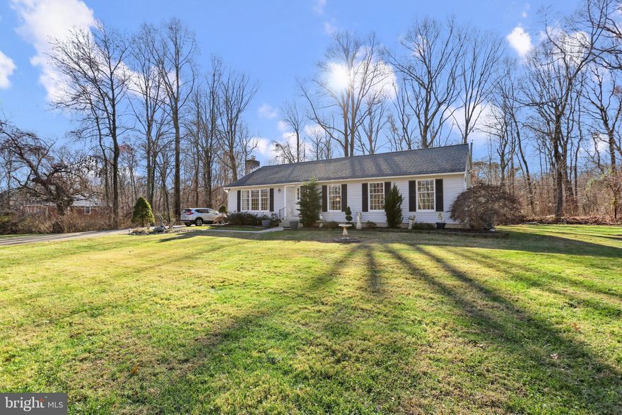 MULTIPLE OFFERS - OFFER DEADLINE SUNDAY 12/18 AT 12PM - OPEN HOUSE SATURDAY 12/17 FROM 11-1!  SPACIOUS WELL CARED FOR RANCHER ON QUIET DEAD END STREET BACKING TO LARGE BALTIMORE COUNTY WOODED PARCEL - this home features pride in ownership with over 2000 sq ft of open floor plan with luxury vinyl plank flooring throughout the main level, convenient main level owner suite with large connecting full bath and separate dining room leading to private rear deck, paver stone landscaping beds and paver stone driveway.  The finished lower level offers a 4th bedroom suite, large rec room with wood burning fireplace, separate laundry room with ample storage and welled walk out basement.  Recent updates include new carpet throughout, new hvac system and architectural shingle roof replaced in the last 3 years.  Sheds & gazebo sold as-is.