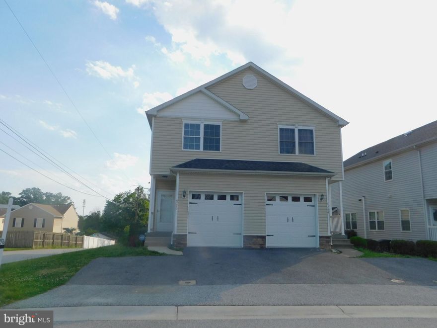 Sought out Harwood Park, comes with 9 foot ceilings, newly painted, new granite countertops, Kitchen Island, 42" Cabinets, 3 Bedrooms, 2 full and 2 half baths, 1 Car Garage and private parking pad, corner lot, gas fireplace, deck.  NO CONDO OR HOA FEE!  Easy access to Rt. 100 and 95.