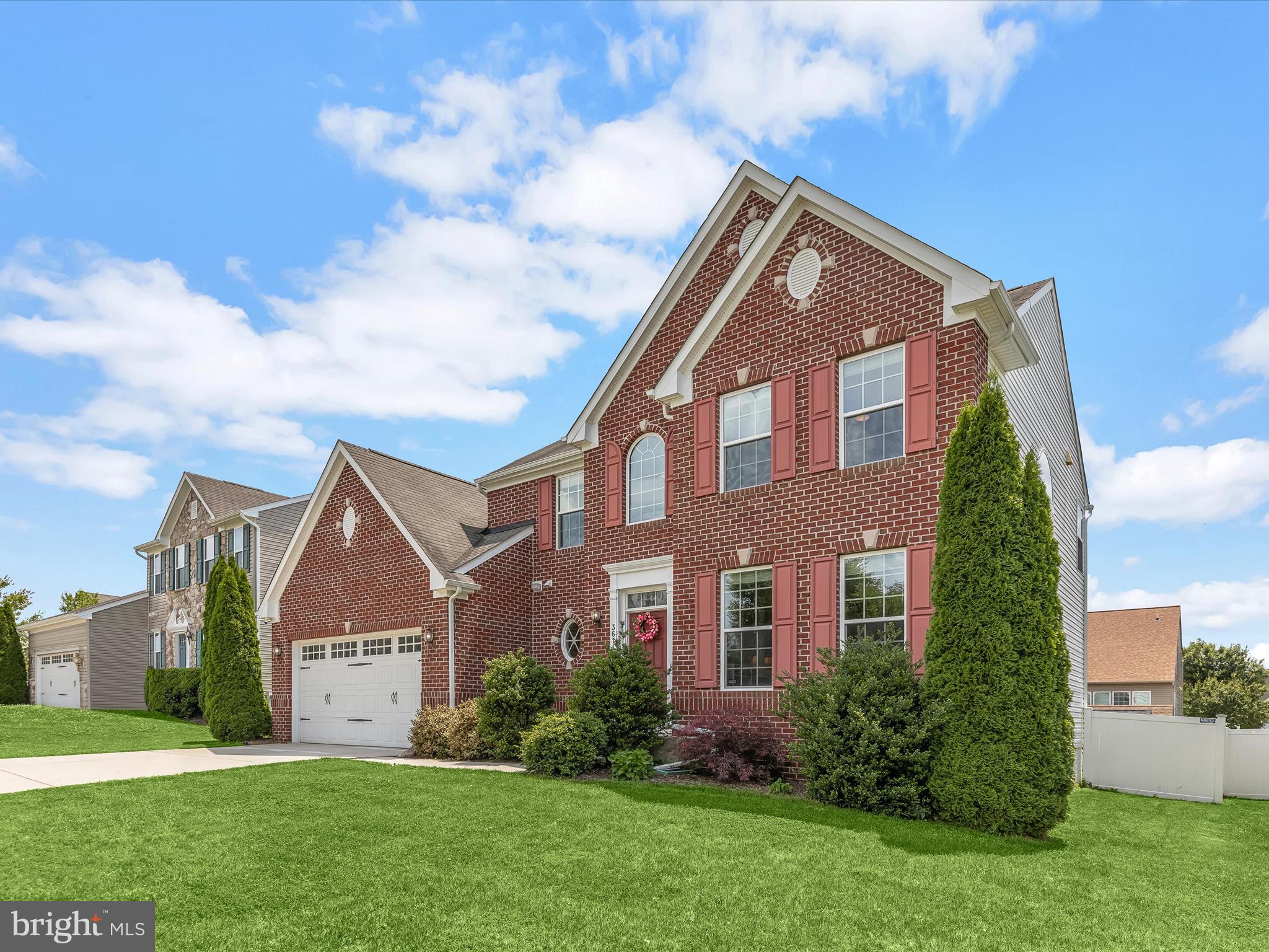 Step inside this beautifully updated 4-bedroom, 3-bath Colonial in the sought-after Eagles Rest community, where thoughtful design, timeless details, and modern updates come together seamlessly. The foyer welcomes you with gleaming hardwood floors, recessed lighting, and a soothing neutral color palette that sets the tone for the home. From there, the sunny living room features elegant chair railing and dentil crown molding, flowing effortlessly into the formal dining room with matching trim and hardwood flooring—ideal for gatherings both large and small. The eat-in kitchen is a standout, showcasing stainless steel appliances, 42” cabinetry, a designer-inspired tile backsplash, and a double sink. The expanded center island offers added storage and seating, making it a perfect hub for casual meals or conversation. Just off the kitchen, the open-concept family room invites relaxation with plenty of space to unwind or entertain. Nearby, you’ll find the main-level laundry, a powder room, and direct access to the garage—all conveniently located. Upstairs, the spacious primary suite is a true retreat, featuring crown molding, an en suite bath with soaking tub, separate shower, private water closet, and two walk-in closets. Three additional bedrooms complete the upper level—one with a walk-in closet and dressing area—all featuring hardwood flooring installed in 2023. A full bath serves the secondary bedrooms with comfort and style. The finished lower level adds incredible flexibility, offering a recreation room with board and batten accents, a bonus room perfect as additional living space, a home office perfect as a 5th bedroom, and a full bath. A cleverly designed under-stair nook provides the perfect kid-friendly fort for imaginative play. Out back, the fully fenced yard offers a true outdoor escape with a custom paver patio, raised garden bed, and a fun-filled play area featuring two playhouses and a swing set—ideal for entertaining or everyday enjoyment. The home has seen a number of thoughtful updates over the years, starting with a stainless steel refrigerator added in 2020. In 2023, enhancements included upper-level hardwood flooring, a new kitchen pantry, an expanded kitchen island, new dishwasher, microwave, stove, air conditioner, and the installation of an outdoor playhouse and swing set. In 2024, additional updates brought new crown molding and chair railing throughout as well as a new washer and dryer. Most recently, in 2025, the entire interior was freshly painted. The lower level was also finished in recent years to include a full bath, offering even more livable space to suit your lifestyle. The seller is offering a $5000 carpet allowance.