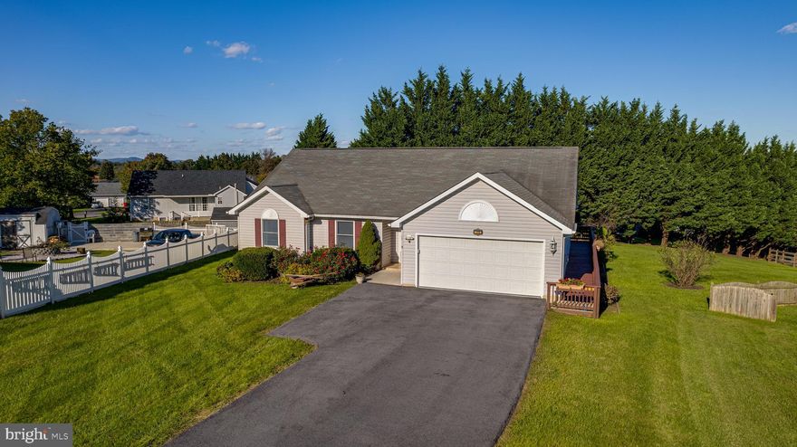 Exceptionally maintained, this maintenance-free 1530 sqft one-level 3-bedroom, 2-bath rancher on .6 acres welcomes you with a large foyer, a nice sized living room, and a formal dining room. A large kitchen offers plenty of cabinets and under-the-counter lighting. The primary bedroom boasts a walk-in closet and a tastefully renovated en-suite bath with walk-in shower. Both baths have undergone stylish renovations. A highlight to this property is the spacious 20x10 4-season sunroom, providing a seamless connection to the backyard and rear deck. The entire home is adorned with laminate flooring.  Additional features include a large 2-car garage with workbench, a sizable deck ideal for entertaining, and two outbuildings offering extra space for storage and your lawn and garden equipment. New HVAC (1 year old) and brand new hot water heater. Gutter guards and other thoughtful details enhance the property. 2 outbuildings 10x16 and 10x8 and a 5ft tall crawl space great for storage and easy to access. Conveniently situated near I-81, the hospital, shopping, and restaurants, this property is a rare find that won't last long!