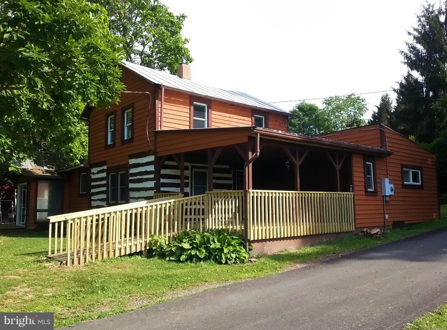 Enjoy the seclusion and privacy of this well kept farm house nestled in the valley surrounded by mountains & Tonoloway Creek.   Home features vaulted ceilings, original log walls from the 1800s, updated kitchen, tile and hardwood floors, woodstove, handicap accessible bath, main floor laundry room, deluxe master-suite w/jetted tub, covered front porch with mountain and stream views.  2nd floor features two bedrms, but you must walk through one to get to other.  The home includes a large storage shed with electric service.  Internet service is provided by Verizon & Hughes Net.  Owner will maintain access road and driveway.   Pets are considered case-by-case.