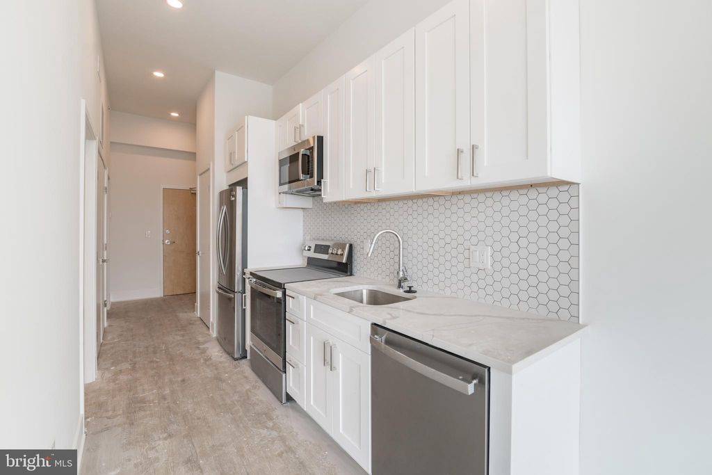 Photo of 1622 Point Breeze Avenue #UNIT 103, PHILADELPHIA, PA 19145 (MLS # PAPH2575084)