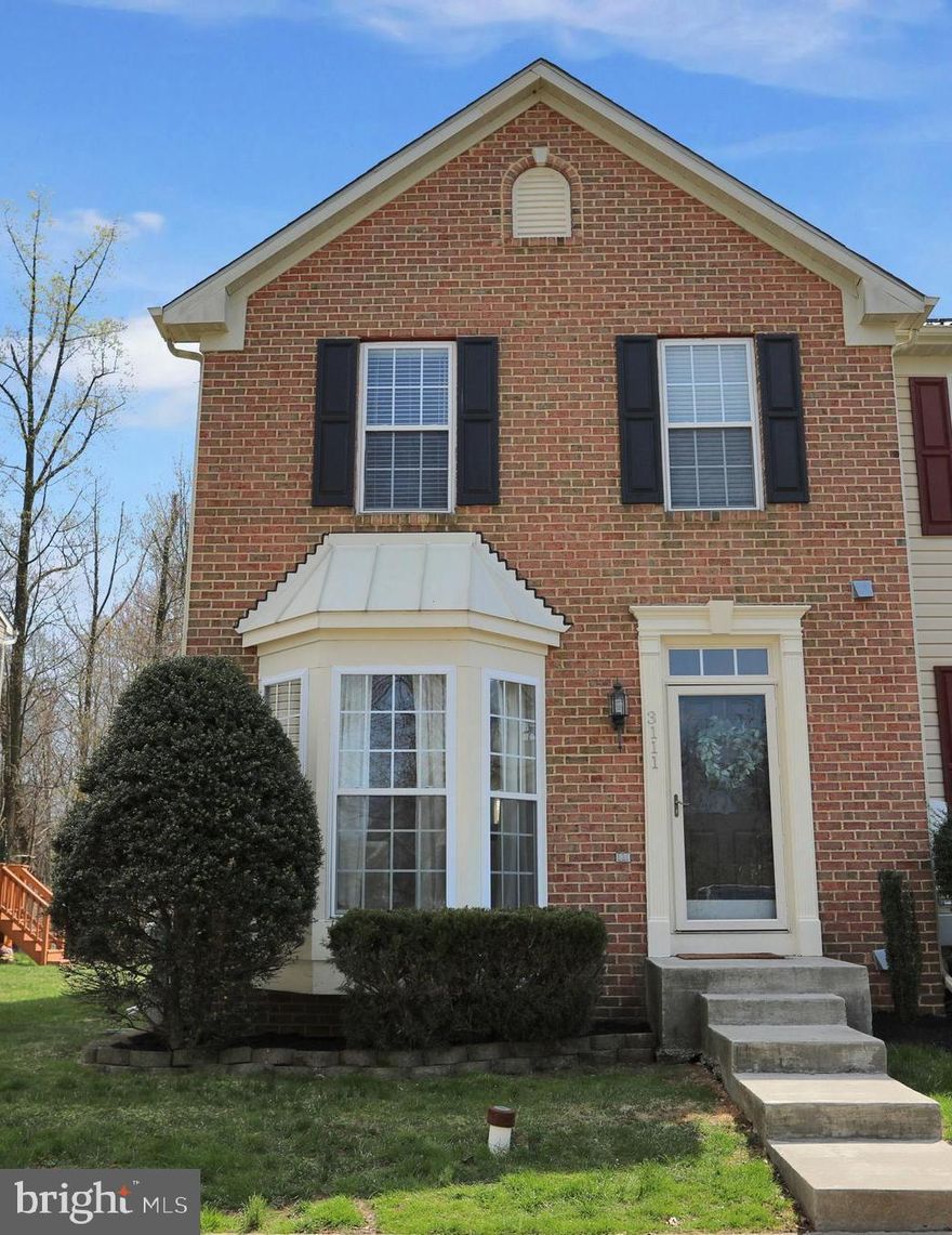 Gorgeous 3 bedroom, 2 full, 2 half bath end unit townhouse with brick front and a bay window.  Gleaming Hardwood floors greet you at the front door with an open floor plan and large great room that flows into a sun filled eat-in kitchen.  Light filled sunroom off the kitchen.  Kitchen also leads to a large deck with plenty of room to grill and entertain outdoors.   Upstairs has 3 bedrooms and 2 full baths.  Basement has lots of storage, entertaining space, bathroom and theater projector for movie nights!  Backyard has privacy, wooded view and is fully fenced. This one won't last, come see it now!  New roof installed in 2018 and hot water heater new in 2017.  Four community playgrounds, convenient location.