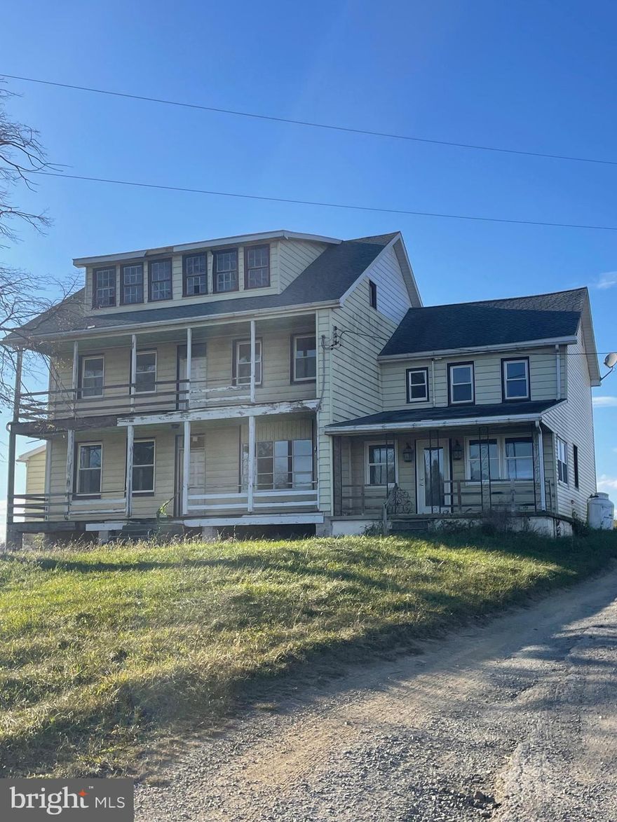 This farm property, located in Hamilton Township just west of Chambersburg, provides many possibilities such as continuing as a working farm, great potential for development possibilities, and maybe a solar farm. Hamilton Township Franklin County PA provides a public works department providing public sewer across Sollenberger Rd. on the north side, a solar ordinance, which may or may not allow a solar farm, or remain a working farm which the land is used for currently.

The lower level of the original farmhouse contains a living room, dining room, sitting room, new half bath and study. A rear partially finished laundry room, an unfinished side porch, a wide covered front porch has had some an updated kitchen with granite counters, center island, propane fireplace, rear staircase to the upstairs. The upstairs contains 4 bedrooms, two of which have closets, 1 half and 1 full bath, and a switch back staircase to the the attic. All of the windows in the main house have been updated.

The home has baseboard hot water and electric heat. There is no central air conditioning. Access to the basement is on the floor of the enclosed rear laundry room off the kitchen

While it is headed in the right direction the home still needs work and improved.

Most of the  outbuildings are in disrepair. However a recent appraisal supports the value which is because of the land and its potential for development.