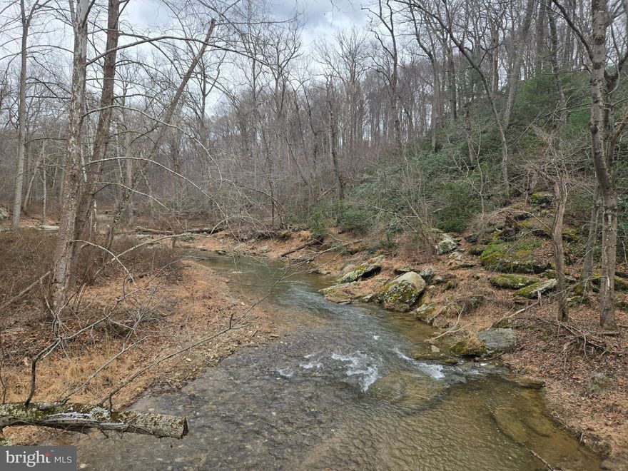 Elevated Home Site ... heavily wooded with a grand view of the valley below and a super view of Morgan Run River and River Valley ... unmatched views!!!    Nice 1.80 acre lot located near Eldersburg, Maryland.  Put 4383 London Bridge Road in your GPS to find the lot ... lot is right after the Morgan Run Bridge ... sign posted ... follow the deer trail which is roughly on the left side of the lot.