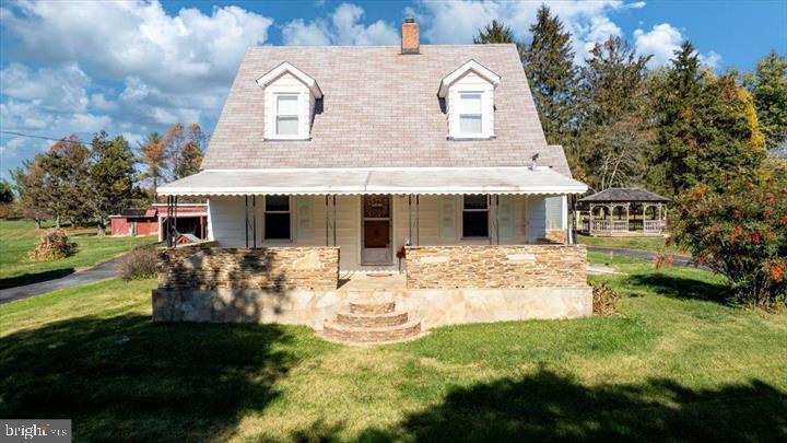 Located in the quiet hamlet of Dayton in Western Howard County, this quaint updated stone cape cod boasts three bedrooms and two full bathrooms. It has undergone extensive upgrades throughout and is situated on a spacious 1.58-acre corner lot. The property is protected on the front by a dense line of trees and is set back from the rural roadside. There are two sizable sheds at the back of the property, along with a small grape vineyard, gazebo, and several old Holly trees. The wood trim throughout the house is a nod to its history and lends a rustic charm to much of the interior, but it also showcases many modern modifications. First floor luxury vinyl planking of the highest caliber was recently installed, and windows were replaced. With newly installed custom cabinetry and quartz countertops, the kitchen looks great. New front load washer and dryer in a handy laundry room on the first level. The main level bathroom has been recently remodeled. There are two spacious bedrooms with hardwood floors and built-in bespoke cupboards on the second story. Complete bathroom on the second level, recently renovated between the two rooms. - Recently installed new electric hot water heater from 2023; - Solaia oil furnace from 2023 with Beckett oil burners; - New septic tank for a five-room home; - Generac propane backup generator with tank; - Well jet pump Not a HOA.
