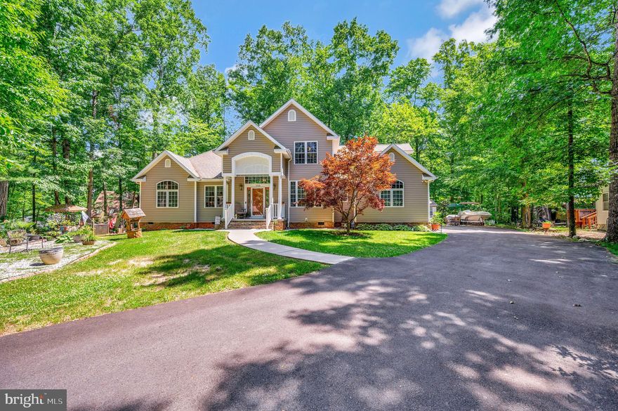 Welcome to your new home located on a wonderful cul-de-sac in the fabulous community of Lake of The Woods in Orange County.  This beautiful 2,563 sq ft home offers four bedrooms, 2.5 baths, formal living room with built in book case and crown molding and formal dining room for your family gatherings, The family room offers two story cathedral ceilings and gas fireplace.  The large kitchen offers stainless steel appliances, lots of cabinets and counter space and breakfast area. Are you looking for a main level primary suite?  Well, this home offers a wonderul  main level primary with two large closets along with a primary bath that offers double vanities, large soaking tub, separate shower stall and separate water closet.  The laundry is located on the main level.  Upstairs you'll find a large loft that overlooks the family room, three additional bedrooms and bathroom.  There is an abundance of storage in this home, the two car side load garage offers even more storage.  Enjoy sitting on the front porch or the rear patio.  Lake of The Woods is a gated community that offers a beautiful 550 acre man-made lake for swimming, fishing, boating and just enjoying the beautiful sunsets.  Go enjoy a wonderful dinner at the Clubhouse overlooking the lake.  There is an abundance of clubs and activities for you to join.  Do you like to exercise?  If so, the fitness center is calling your name.  Nothing like walking on a treadmill looking out at the lake instead of watching the news.  Many trails and parks for you to enjoy the outdoors. Located between Fredericksburg and Culpeper.  The area offers restuarants, banks, shopping and so much more. You'll love living at the lake and more than that, you'll loving calling 110 Sunset Ct. your home!