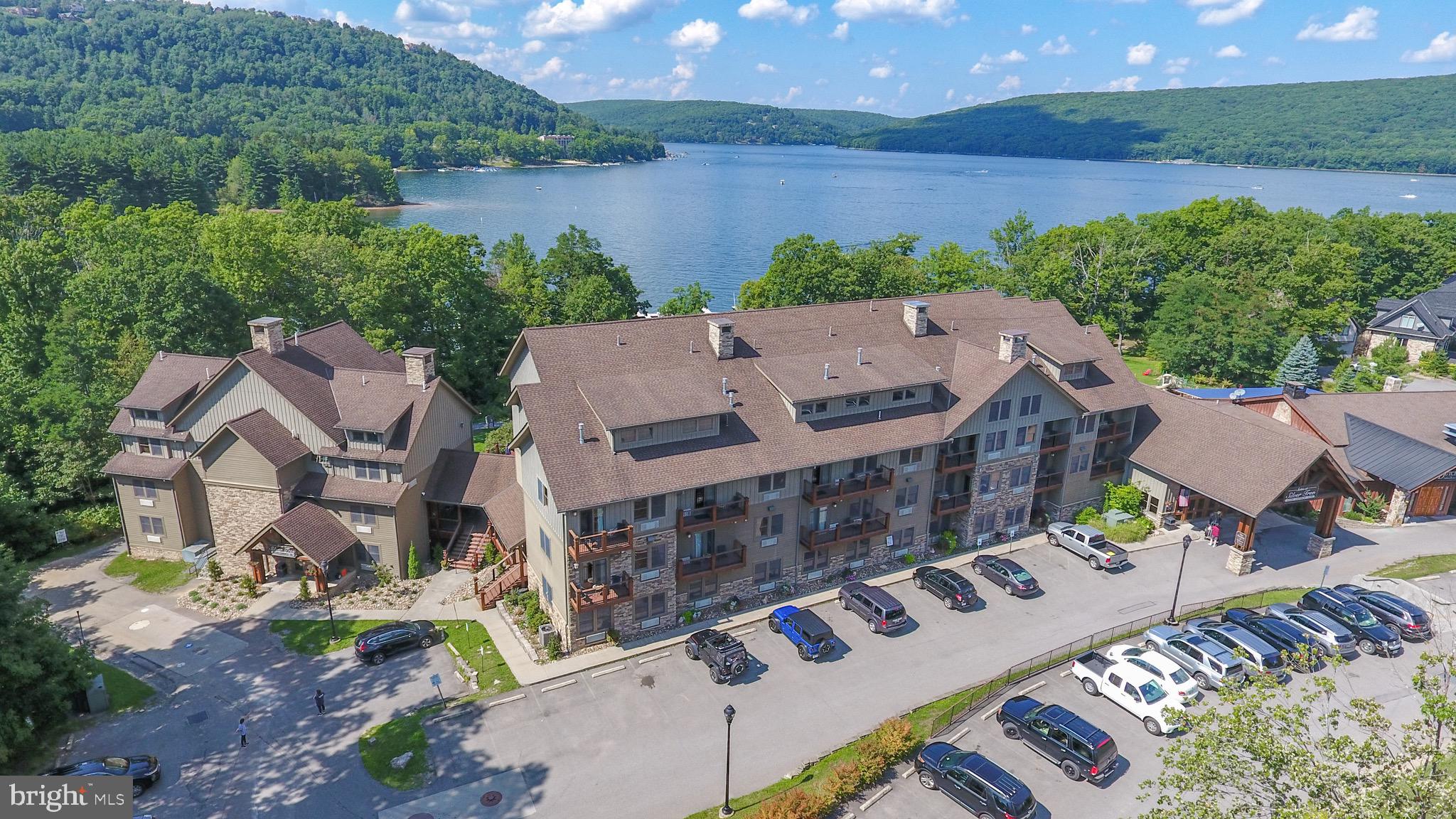 Don't miss this rare opportunity to own a beautifully updated 1-bedroom unit at Silver Tree Suites on Deep Creek Lake! This turn-key condo features recent upgrades and is being sold fully furnished, making it perfect as a vacation getaway or income-generating rental. The unit boasts a solid rental history, offering immediate investment potential. Enjoy access to a wide range of on-site amenities, including a fitness center, sauna, laundry facilities, and general lake access. Located just steps from the popular Dutch’s at Silver Tree restaurant and the Harbor Bar, you’ll love the convenience and charm of this premier location. Whether you’re looking for a cozy retreat or a smart investment, this Silver Tree Suites unit delivers on all fronts—comfort, convenience, lakefront living, and a tremendous price tag. Schedule your showing today!