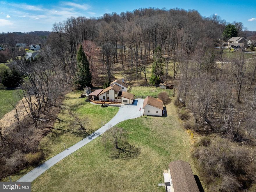Come enjoy a place called “home” down a long lane on 2+ acres with plenty of room for your loved ones and pets in a terrific Chester Springs location. Whether you enjoy chipping golf shots in your backyard, playing dog frisbee, or sitting on the front porch with a coffee in hand-peace and quiet permeate this space. This 3 bedroom 2.5 bath 2 story home is solid and inviting . It also offers a fantastic detached 3 car garage with plenty of storage, fenced in back yard and shed, a detached shed with storage and a golf room set up, large covered deck and patio and last but not least, a dip-in 4 foot deep pool.  This home is surrounded by woods and is home to many deer and wildlife to enjoy from your kitchen window and porch all year round! You will never be bored on this property! Come and see it today!