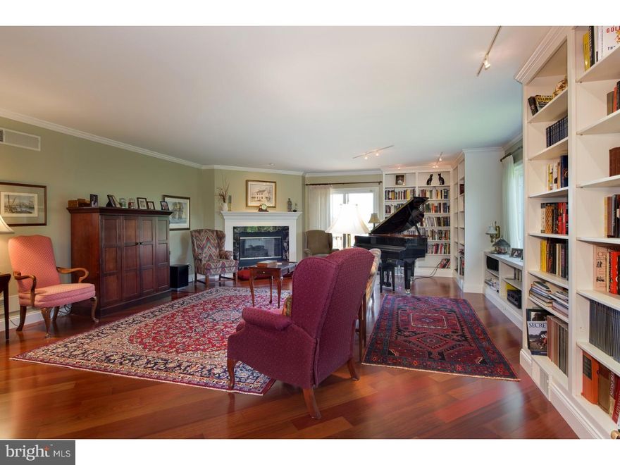 Absolutely stunning 3-level condo in Longvue Estates with elevator.  You will be blown away by this beauty. Press elevator down and you will be greeted by the recently remodeled and exquisite lower level.  Fully equipped with bar/kitchenette area featuring: Granite counter tops, soft-close drawers and cabinets, under-mount lighting, pendant lights over the bar area, dishwasher, and more. Lower level also features diagonal patterned wood floors, gas fireplace, accent lighting and full bath with tiled floor and shower. Take the elevator up to the main living area featuring beautiful, and rich wood floors throughout the hallways, living room, and dining room.  6" base moulding and crown moulding provide that added touch of class.  Huge living room with amazing views, gas fireplace, and 150 linear feet of built-in bookshelves.  Kitchen features granite countertops, high-end appliances, skylight above eat-in section and plenty of cabinet space.  Jack and Jill bathroom between bedroom 2 and 3.  Extensive Master Bedroom Suite with deck and fantastic views.  You will not be disappointed with the room sizes and amenities this home and neighborhood have to offer.  Association fee includes all ext maintenance, pool, tennis court, club house, water, sewer, trash, and common area maintenance.  Please note square footage includes finished section of lower level.