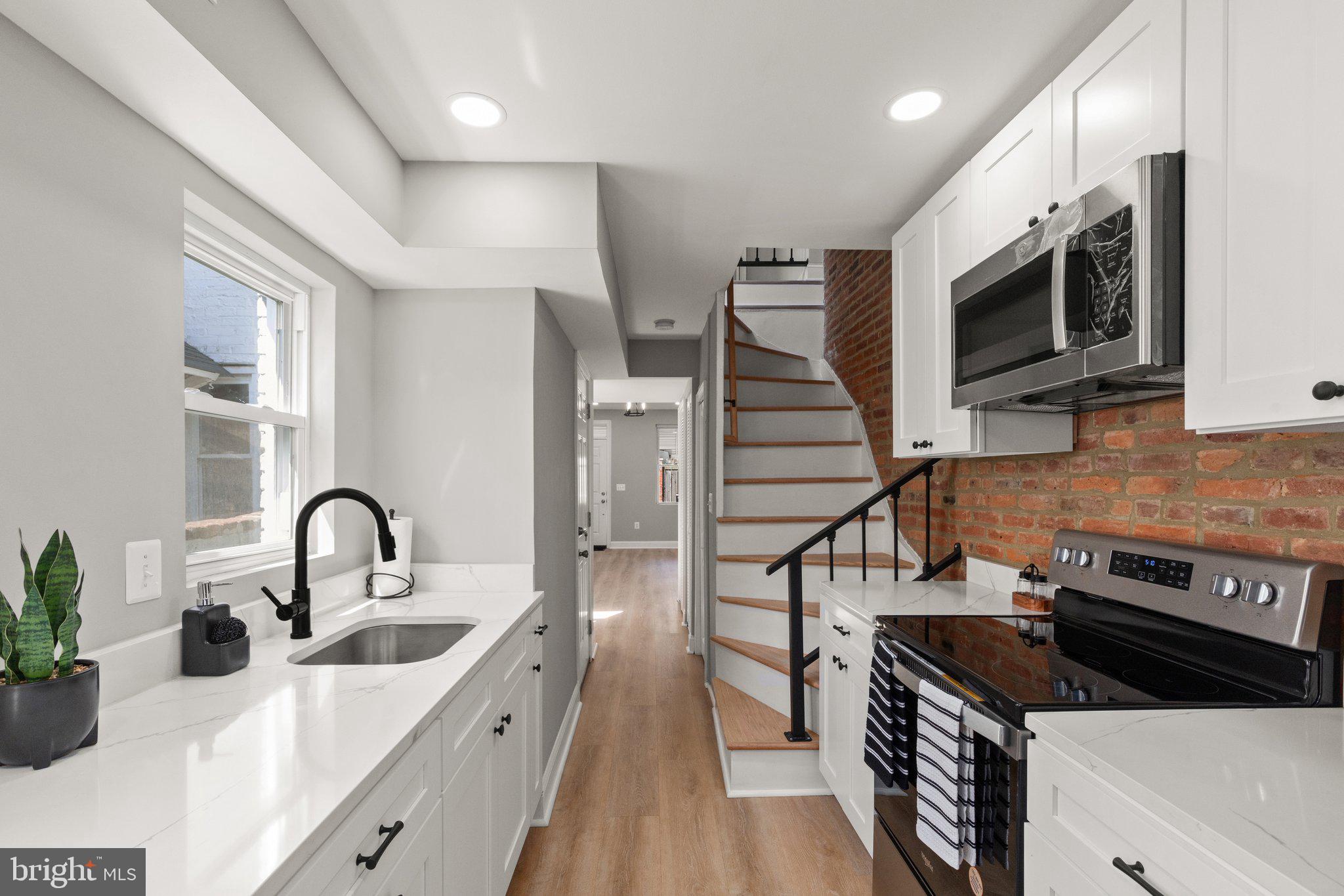 Welcome to 533 S Chapel Street, a stunning 3-bedroom, 2-bathroom interior townhome nestled in the heart of the historic Fells Point district. This cozy home has been thoughtfully renovated and remodeled from top to bottom, bringing modern comfort and style to this charming property.
As you step inside, you’ll immediately notice the extensive renovations that breathe new life into the home. The brand-new kitchen is a true highlight, featuring sleek quartz countertops, all-new stainless steel appliances—including a stove with a bonus air fryer—and ample cabinet and countertop space. The bathrooms have been completely transformed, with one of them being newly added during the remodel to provide extra convenience and modern amenities. New flooring and fresh paint throughout the home along with stylish new lighting fixtures further enhance its modern appeal.
Beyond the surface, this home has been updated with essential new systems, including a new HVAC system for year-round comfort, a new water heater, and new shingles on the main roof to ensure lasting durability. The remodeling efforts include increased ceiling height, creating a more spacious and inviting atmosphere, while the upgraded electric panel and new electrical wiring provide added peace of mind.
This cozy home has an efficient layout that makes the most of every square foot, offering a comfortable and stylish living environment. Located in one of Baltimore’s most desirable neighborhoods, you’ll be just steps away from the waterfront, local shops, and vibrant dining spots.
533 S Chapel Street is a rare find—completely renovated and thoughtfully remodeled to combine historic charm with modern luxury. Don’t miss your chance to make it yours!