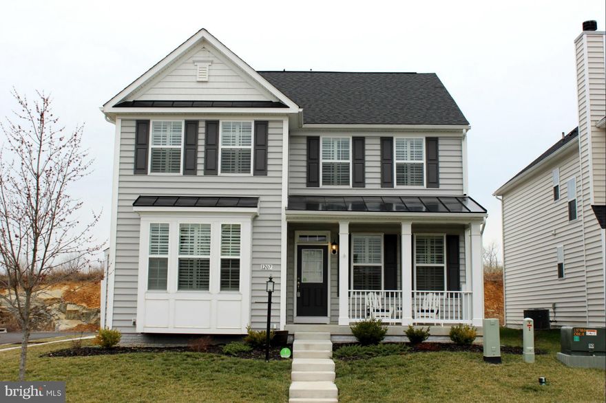 Gorgeous Colonial features a 2 story family room w/floor to ceiling stone fireplace, dark hardwood floors, crown molding, custom plantation shutters/blinds throughout, stainless appliances, granite countertops, & mstr suite w/tray ceiling, soaking tub, sep shower, & walk-in closet. Attchd 2 car garage & vinyl fenced back yard. Finish the walk-up bsmt w/bath rough-in for even more living space!