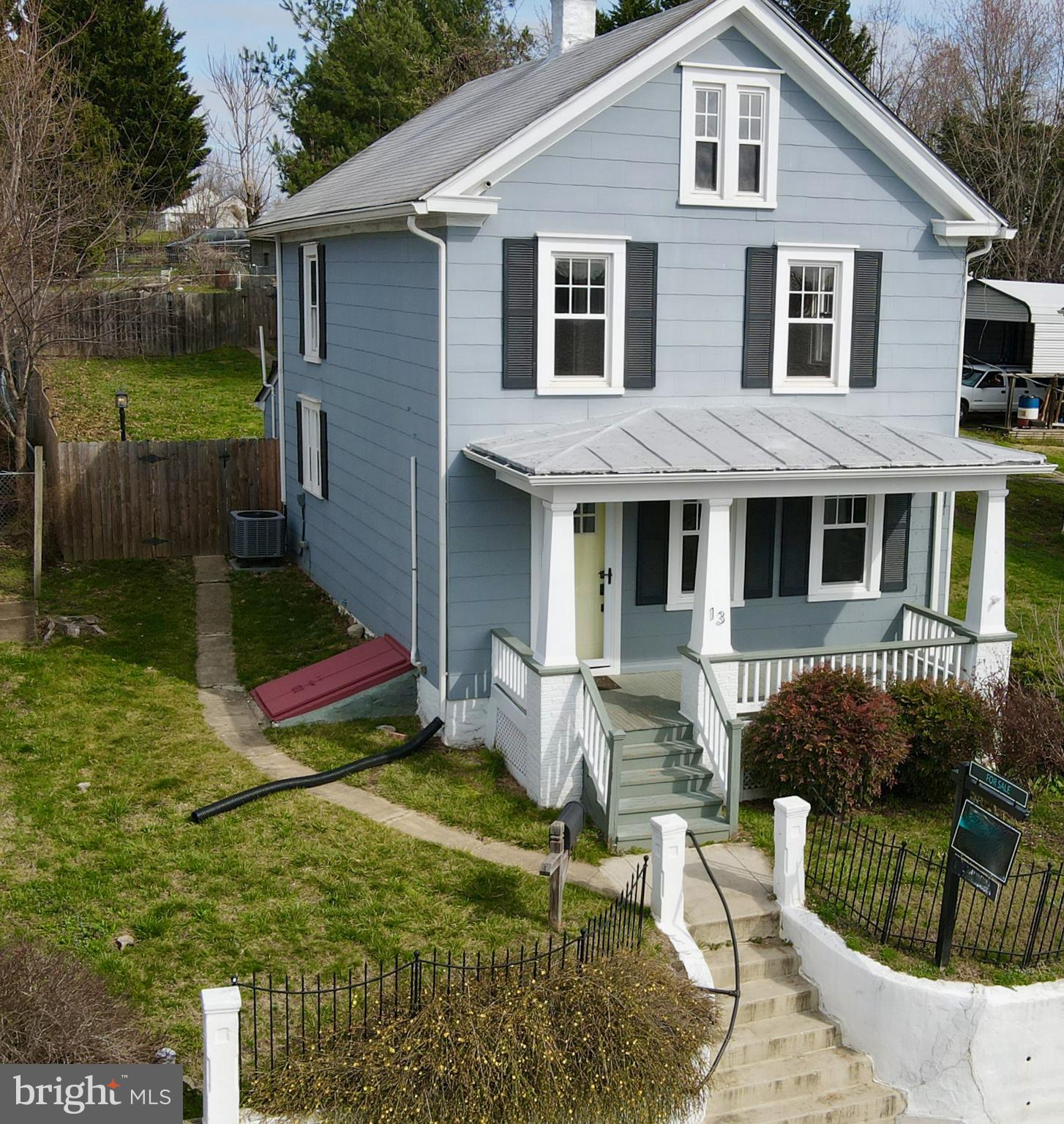 Welcome home to this beautiful updated turn of the century Craftsman with modern conveniences. Relax on your large front porch with or on your covered rear porch and deck leading to your fenced backyard. Hardwood floors throughout with the exception of one bedroom that has LVP. The upper level floors are original to the home and have been newly refinished. Updated white kitchen cabinets, granite counters, and stainless steel appliances. Electric heat and central air conditioning help modernize this home, along with updated windows. Laundry room/half bath on main level. There is off street parking behind the back fence with access from the alley. Convenient location near dining, parks, MARC train station, and C&O Canal.