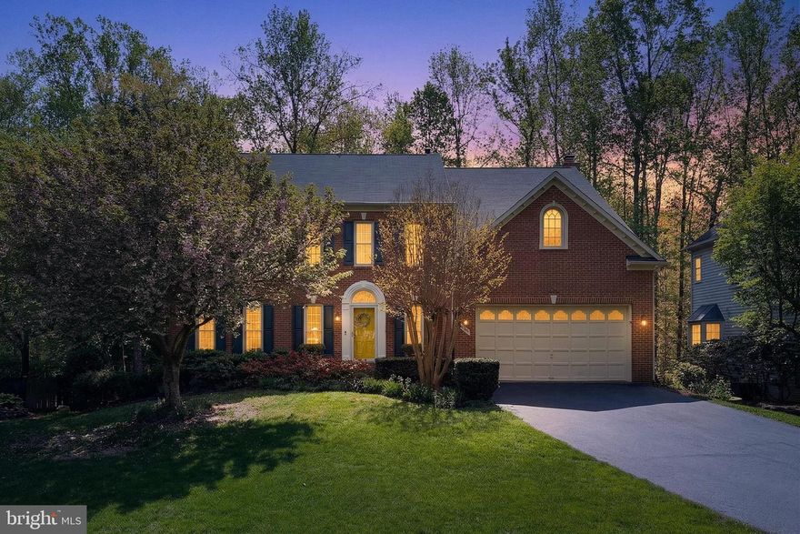 Beautifully Updated & Spacious home in excellent condition. 5 bedroom, 3.5 baths - Brick Front on a very private, fenced yard backing to Heavy Treed Common area.** 2 Story Foyer*  Gorgeous remodeled kitchen  2018/2019 - White cabinets,  Quartz counters, Stainless appliances - double wall oven, gas cooktop, microwave. Dishwasher (2024)!  Lovely Solid Hardwood floors on entire main level, staircases , loft and all bedrooms!!  This home has a Sunroom/Breakfast room extension with access to Large Deck!  9 foot ceilings main and upper floors!  HUGE main floor family room w/Beautiful Wall to Wall raised Fireplace Hearth & FP Gas Logs** HUGE Primary bedroom, & walk-in closet **  Fully remodeled Primary bath - double vanities, free standing soaking tub & Shower 2022**Hall bath was fully remodeled too!! Upper level has a loft with lovely built-in cabinets** The lower level has a huge 2nd family room, gaming or exercise area, Large 5th bedroom with connecting Renovated  full bath 2023**Water Heater 2025** Lots of storage with built-in shelving**  Garage a lots of extra shelving** Quick Occupancy**