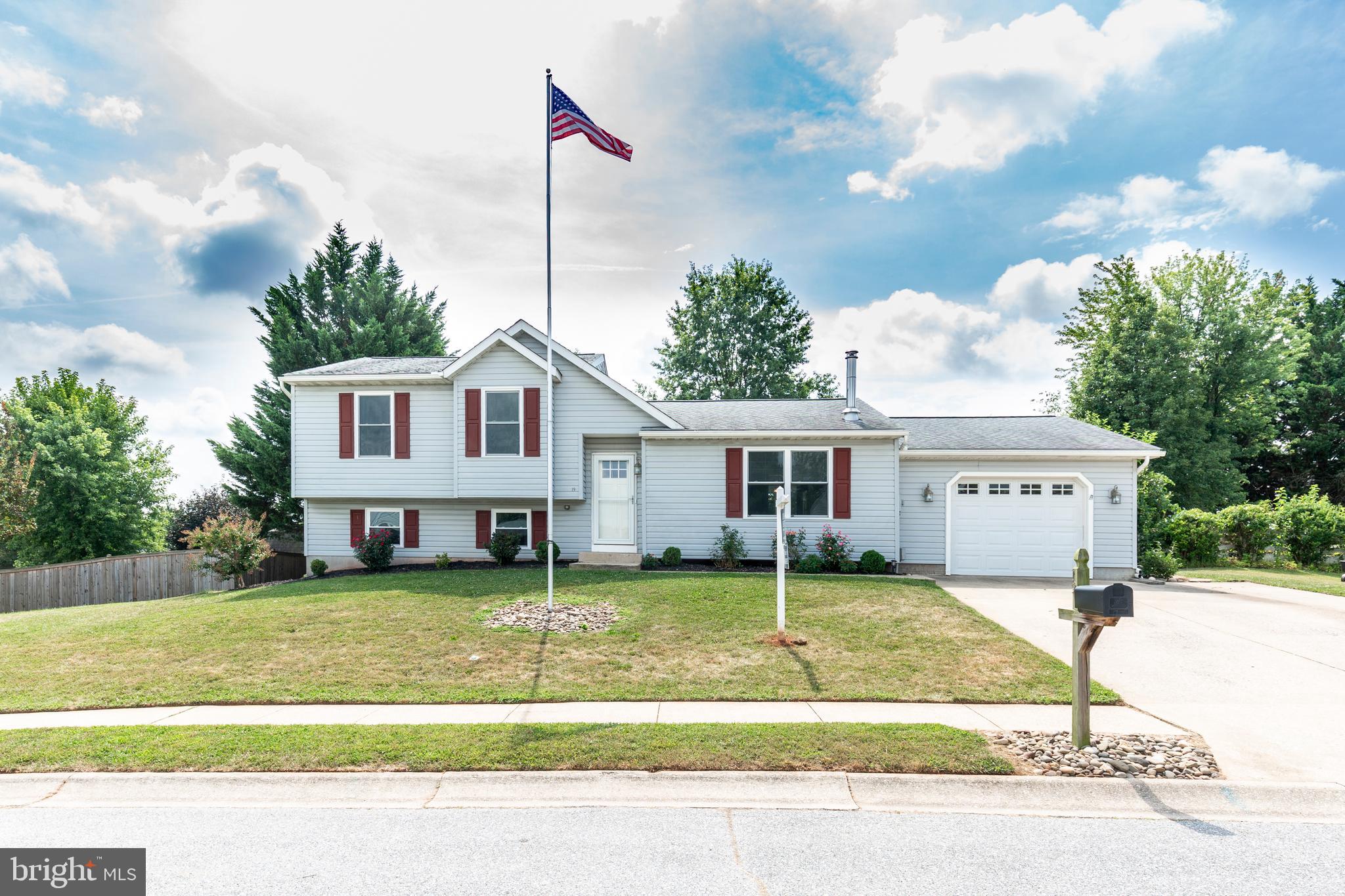 Welcome home to this beautifully updated split-level gem featuring 3 spacious bedrooms and 2 full remodeled bathrooms! Step inside to all-new carpet and luxury vinyl plank flooring throughout, fresh interior paint, and a bright living room warmed by a cozy wood stove. The country-style eat-in kitchen shines with stainless steel appliances, including a brand new refrigerator and oven, plus a 2023 dishwasher. The finished lower level offers extra living space and a bathroom rough-in, perfect for future expansion. Enjoy the outdoors from your private deck overlooking a fenced, shaded yard complete with a storage shed. A 1-car garage with attic storage adds convenience. Major system upgrades include: replacement windows (2023), water heater (2025), roof (2017), complete HVAC system (2021), gutters (2022), and wood stove (2017). This move-in ready home has it all—schedule your showing today!