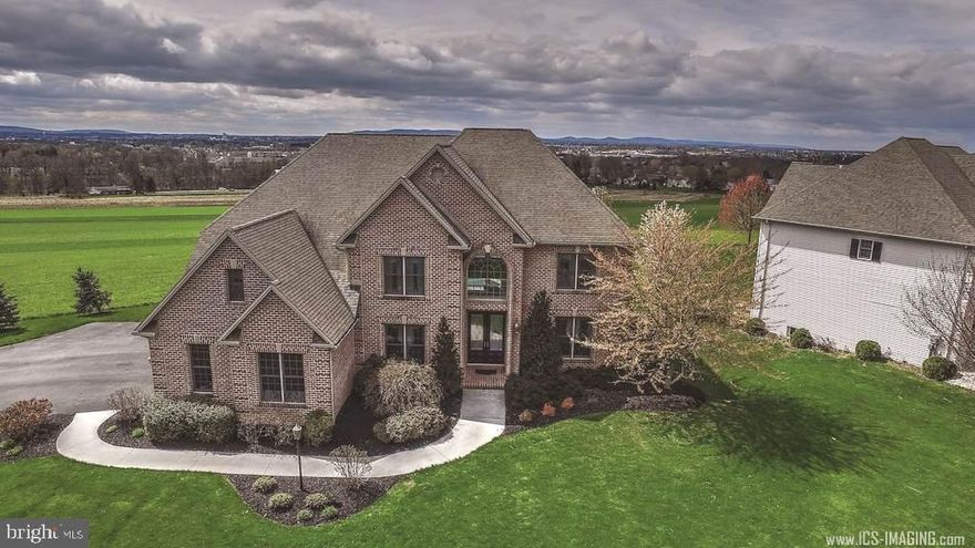 Price reduced! This stunning, well-appointed 2 story home in Hampden Township. Amazing views from every room in the rear of home featuring a dream kitchen w/ lg center island, 2 sty family room w/2 sided FP, 1st floor guest room, butler's pantry, beautiful HW floors, 1st fl Lau, lg master suite, 2 sided FP & balcony overlooking view, enjoy the gorgeous sunsets. Finished lower level complete w/bar, gas fireplace, workout room and half bath. Meticulously maintained grounds, heated salt water pool & much more!