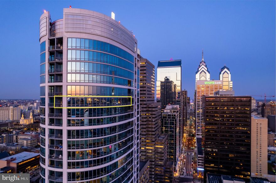 Welcome to the ultimate luxury living experience at the combined unit 3803/3804 of The Murano Condominiums, where jaw-dropping features and breathtaking views of Center City Philadelphia will leave you awe-inspired. This one-of-a-kind property boasts not one, but TWO DEEDED PARKING SPACES and TWO STUNNING BALCONIES, offering an unparalleled urban living experience. As you step into this 3-bedroom, 3 bathroom condo, you'll be greeted by a calming and sophisticated entry hall lined with French Imported individually cut, crystal wall sconces and coat closets that sets the tone for the rest of the space. The open-concept living area is a true showstopper, featuring curved, floor-to-ceiling windows that flood the space with natural light, and offer unparalleled views of the city skyline, a custom acrylic painted column designed to blend in with the city scenery and custom glass shelving.  The kitchen is a chef's dream, featuring top-of-the-line stainless steel appliances, granite countertops, custom cabinetry, mirrored backsplash, wine refrigerator and beverage cooler at the custom built coffee bar area and a large breakfast bar that's perfect for entertaining. The adjacent dining area offers ample space for hosting dinner parties, while the living room provides a comfortable and inviting space for relaxing with friends and family.  Just off the dining area you will find a perfectly situated family room/ home theater with extended wall and 5 high-end, built-in speakers and a  modern ceiling fan.  On the opposite side of the hallway you'll find a gorgeous,  upgraded full guest bathroom with marble counters, tub and shower and tasteful wallpaper.  As you make your way to the Eastern Side of the condo, you'll discover a charming faux wood wallpaper room currently being used as a den but this versatile area offers a myriad of possibilities and can easily be converted into a third bedroom or a space that aligns with your personal lifestyle and preferences. Finally you'll enter the spacious primary suite that offers multiple custom closets, custom automated TV bracket system and breathtaking views of the city skyline from its private balcony. The ensuite bathroom is a luxurious haven, complete with a double vanity, a glass-enclosed shower, and a soaking tub that's perfect for unwinding after a long day. The additional bedroom  is equally impressive, with its own upgraded bathroom, plenty of closet space and large windows that offer natural light and stunning city views. The entire home is fit out with programable Lutron automated window treatments and custom lighting.  All sound equipment and tv's are included in the sale! The Murano Condominiums offer a host of amenities that cater to your every need, including a state-of-the-art fitness center, indoor pool, community room with kitchen, 24-hour concierge service, and a stunning outdoor sun deck. The Murano is located in an exciting and rapidly developing section of Center City and is walking distance to 30th Street Station, a few steps away from Trader Joes, and everything else Philadelphia has to offer.  Don't miss out on this rare opportunity to own a property that's both luxurious and practical, with the added convenience of two deeded parking spaces. Schedule your showing today and experience the ultimate in city living at The Murano.