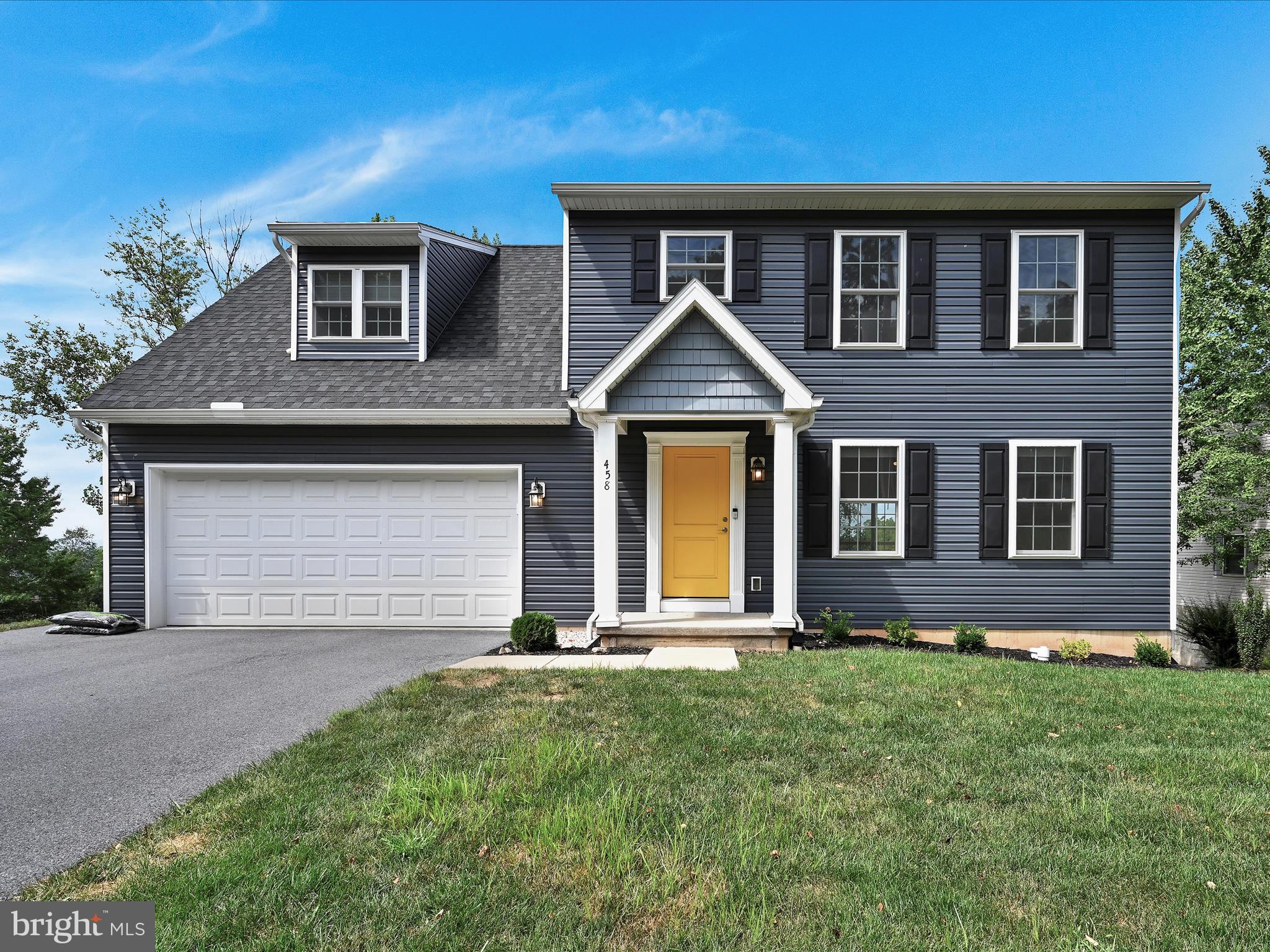 Welcome to this beautifully maintained 4-bedroom, 2.5-bath home in the heart of Ephrata! Built in 2020, this property blends modern comfort with timeless curb appeal, featuring striking dark blue siding, and classic shutters. Inside, you'll find an open-concept floor plan with abundant natural light, a spacious living area, and a modern kitchen equipped with stainless steel appliances, ample cabinetry, and granite countertops. The dining area flows seamlessly to a rear deck overlooking the backyard, ideal for summer BBQ's and relaxing evenings. The second floor includes a primary suite with an oversized closet and full bath, plus three additional bedrooms and a full hall bath. The unfinished walk-out basement provides additional space for storage, or can be finished for additional living space! Situated on a gently sloping lot with a 2-car garage and off street parking, this home provides both convenience and style. Located close to schools, and all the charm of downtown Ephrata, this move-in ready home is truly a rare find.