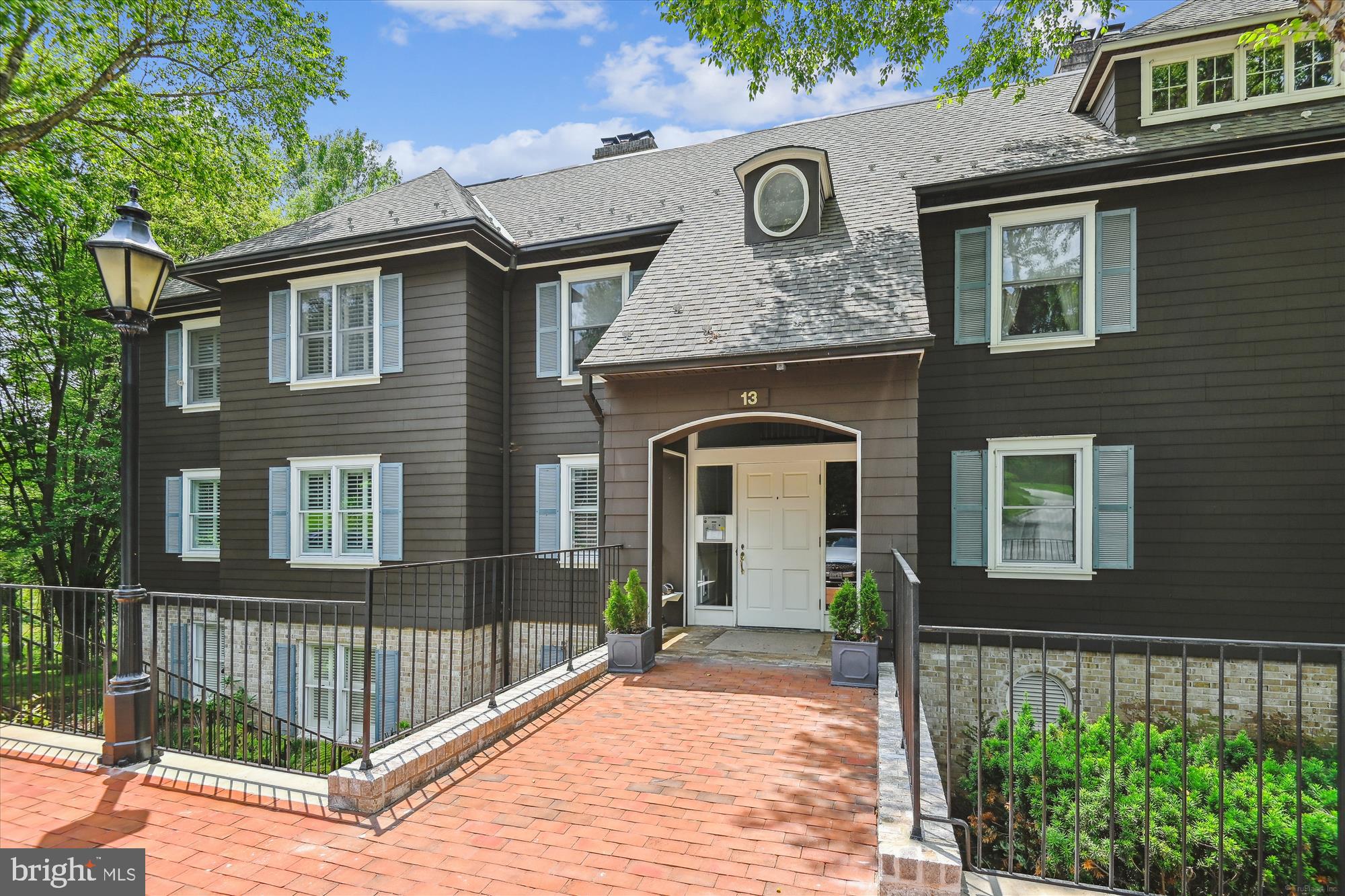 Step into this sophisticated yet comfortable condo in the desirable Devon Hill community. An award design by Marty Azola, a developer specializing in historical properties. Azola transformed this space into luxury properties, maintaining the formal English gardens designed by the Olmsted brothers. Brown shingle buildings set against velvety green grass fondly referred to as "Cow Hill" by locals. 3 bedrooms, 2 full baths , 10 ft ceilings, hardwood floors, traditional molding, solid wood doors, and oversized rooms makes this feel more like an individual home. Presently one bedroom is used as a den. The wood burning fireplace is the focal point of the living room. The piece de resistance is the Sunroom with floor to ceiling windows and views of the gardens. Plantation shutters and bamboo blinds convey with the unit. Large storage room with a work bench and electricity. Baltimore County location conveniently located near Lake Roland, desirable schools, shopping and major transportation.
Seller has paid the recent assessment in full. The HOA covers common area maintenance, lawn maintenance, management, reserve funds, road maintenance, snow removal, water