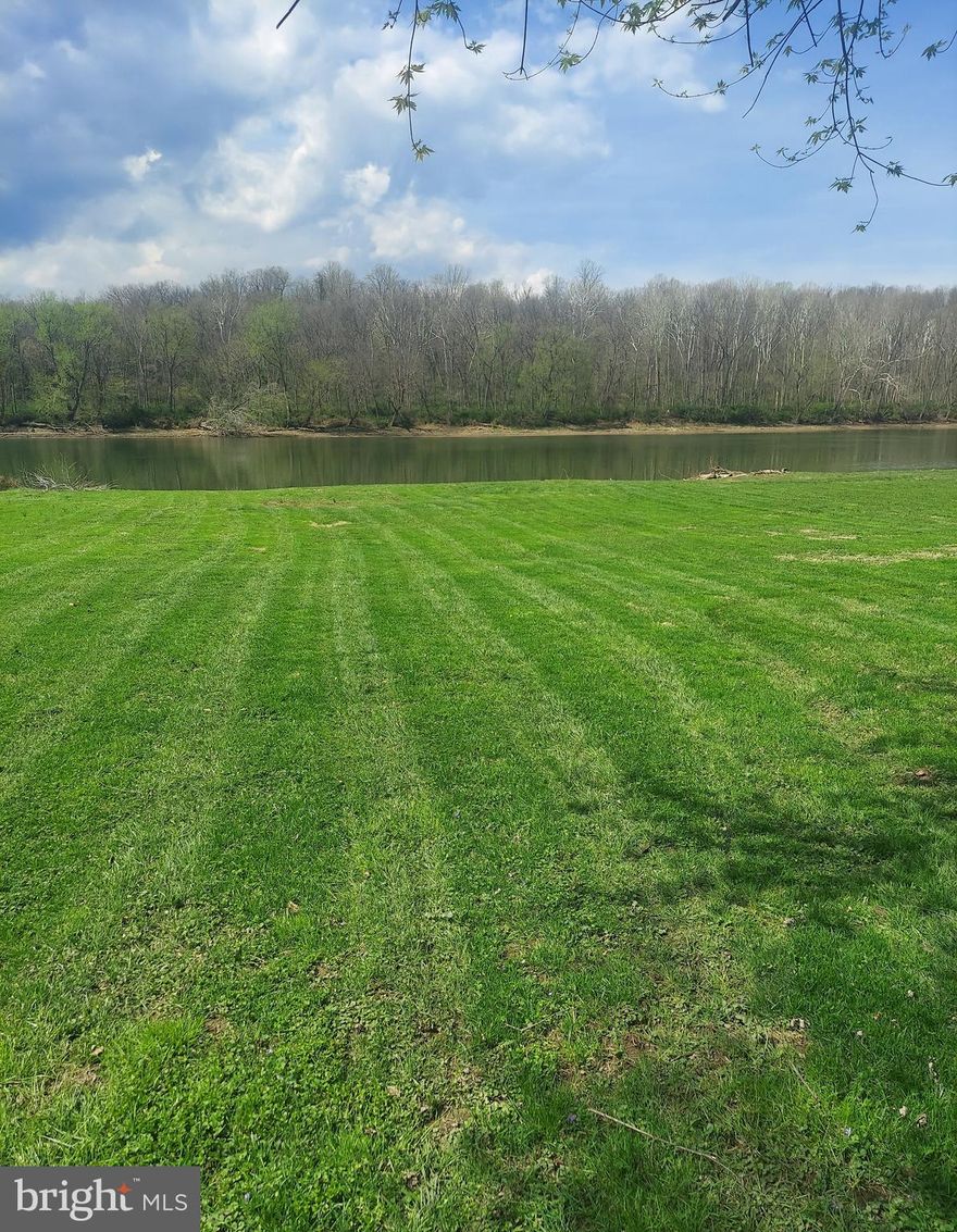 Build your dream vacation home or full-time residence on this beautiful 1.08-acre riverfront lot along the Potomac River in the sought-after Honeywood Subdivision of Falling Waters, WV. With deep water access, this property is ideal for boating, kayaking, fishing, or simply enjoying the peaceful rhythm of riverfront living.

Residents of the Honeywood community enjoy access to a swimming pool and tennis courts, offering relaxed recreational options that complement the natural surroundings. Conveniently located approximately one hour from Frederick, MD, and nearly two hours closer to the Washington, DC, and Baltimore, MD metro areas than Deep Creek Lake, this location is perfect for easy weekend getaways, day trips, or extended stays.

Whether you envision a private retreat, a comfortable primary residence, or a potential vacation rental (buyer to verify), this property provides a rare opportunity to create a custom home in a serene riverfront setting that feels worlds away—yet remains easily accessible.
