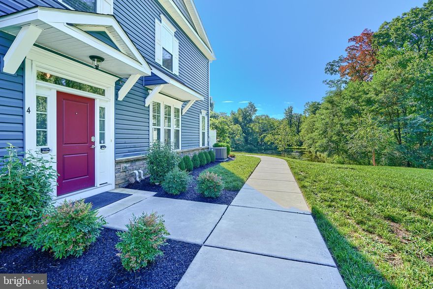 This Gorgeous 3 bed 2.5 bath Villa overlooks your own private nature sanctuary complete with pond, birds, wildlife and forest!  Situated in the Hopkins Landing water-oriented community, this home features vaulted ceilings, a gourmet kitchen with two-tone cabinets, upgraded appliances and fixtures, a gas fireplace with new granite surround and wood mantle plus a 1st floor primary suite with a large designer bath and walk-in closet. Upstairs you'll find 2 bedrooms, a full bath, office and a utility/storage room. There are so many upgrades and added touches including custom live edge built in shelves, dimmers in every room, new upgraded fixtures and lighting, custom accent wall in primary bedroom, built in nightlight outlets, a retractable screen door and more. Did I mention you have your own separately deeded garage with remote?  This beautiful and serene community is a nature lover's dream including over one mile of scenic walking paths that meander along the water's edge, through woods, and over bridges. Observation platforms border the path providing places to rest, read or just watch the sunset.  Condo & recreation fees include lawn care, landscaping, water, snow removal, community pool,  walking paths and more. Boat slips available for purchase or rent at the community marina. Never mow a lawn, pull a weed, or shovel show again.