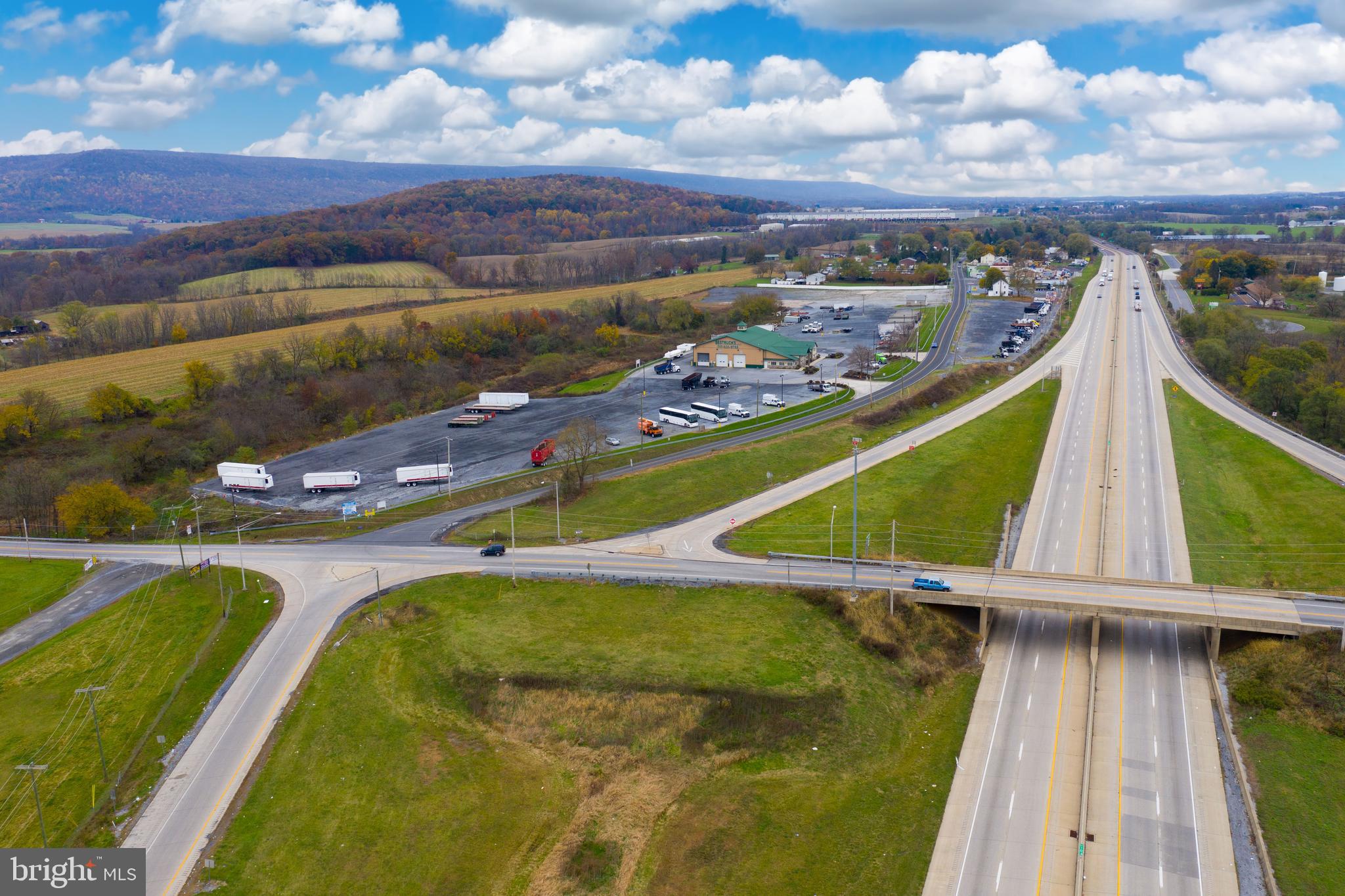 Prime location for any Industrial - Commercial use in Bethel Township, Berks County, Pennsylvania. Quarter of a mile of frontage on interchange I-78, across from Flying J Truck stop. HIGH VISIBILITY. Many potential uses. Currently the BESTRUCKS facility (business NOT for sale - real estate only) with large 10,000 SF building hosting many offices, large, drive-through shop areas on over 22+ acres with 50+ truck / trailers spaces. SUBDIVISION POSSIBLE. Possible Lease Opportunities.