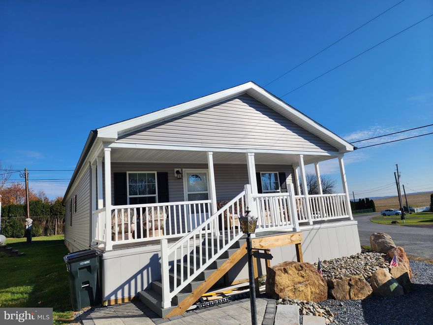 Welcome to this new 2023 double wide, custom designed home! 
Plenty of upgrades built into this home with two full baths, drywall walls, recessed lighting, tile surround shower stall with glass door, kitchen with island, 5/12 pitch roof, insulated skirting, central AC and composite, low maintenance decking.
Enjoy the summer breezes on the covered porch and an open interior floor plan with large southern windows allowing plenty of natural sunlight into the living room and kitchen area. Three bedrooms with two master suites as well as outdoor entry laundry and utility room. 
Temporary tenant residents are currently maintaining the home until new buyers are secured.